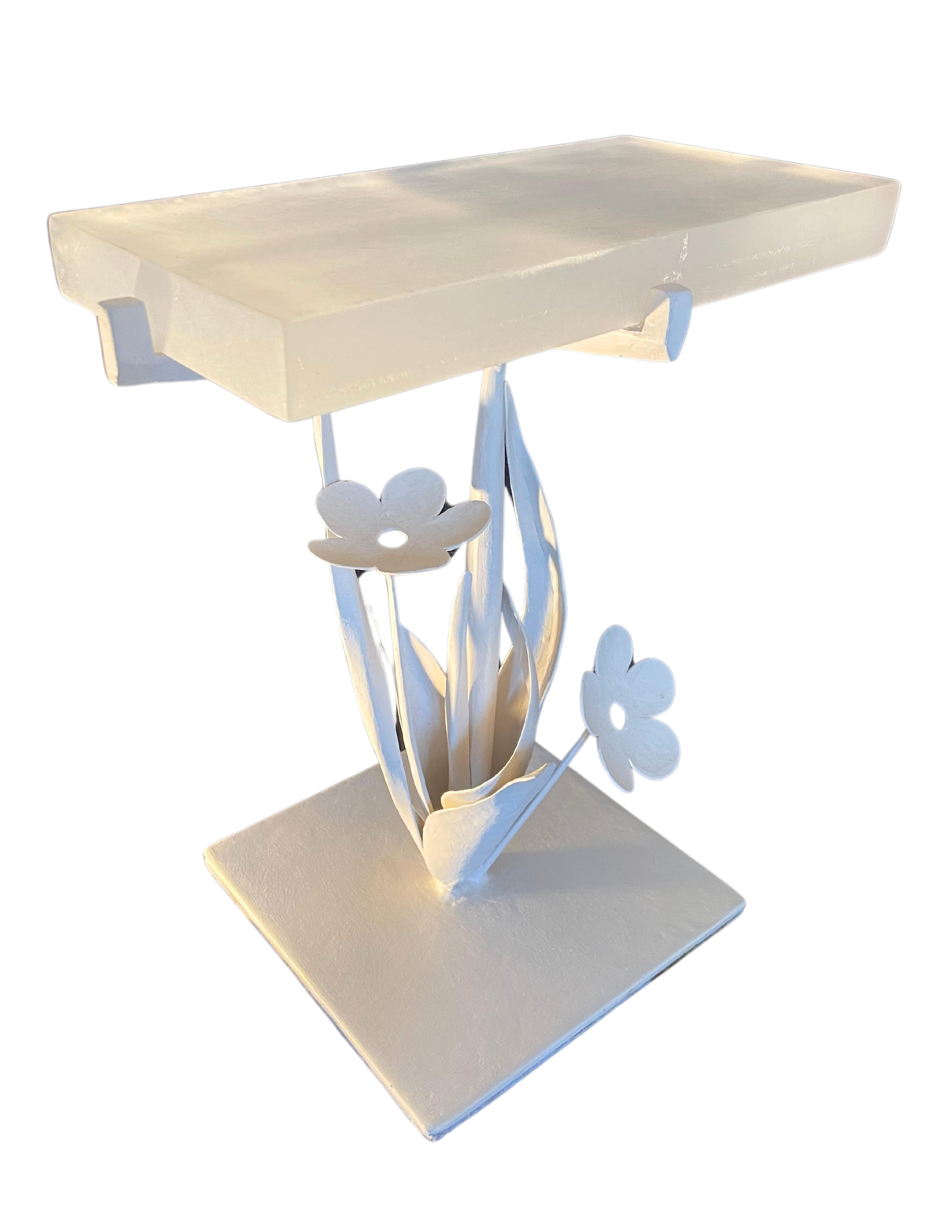Transform your living space with the enchanting elegance of our jewel-like side table, adorned with intricately shaped flowers, a small sculpture that adds a touch of artistic allure to any room.

www. alexandervoneikh. com

