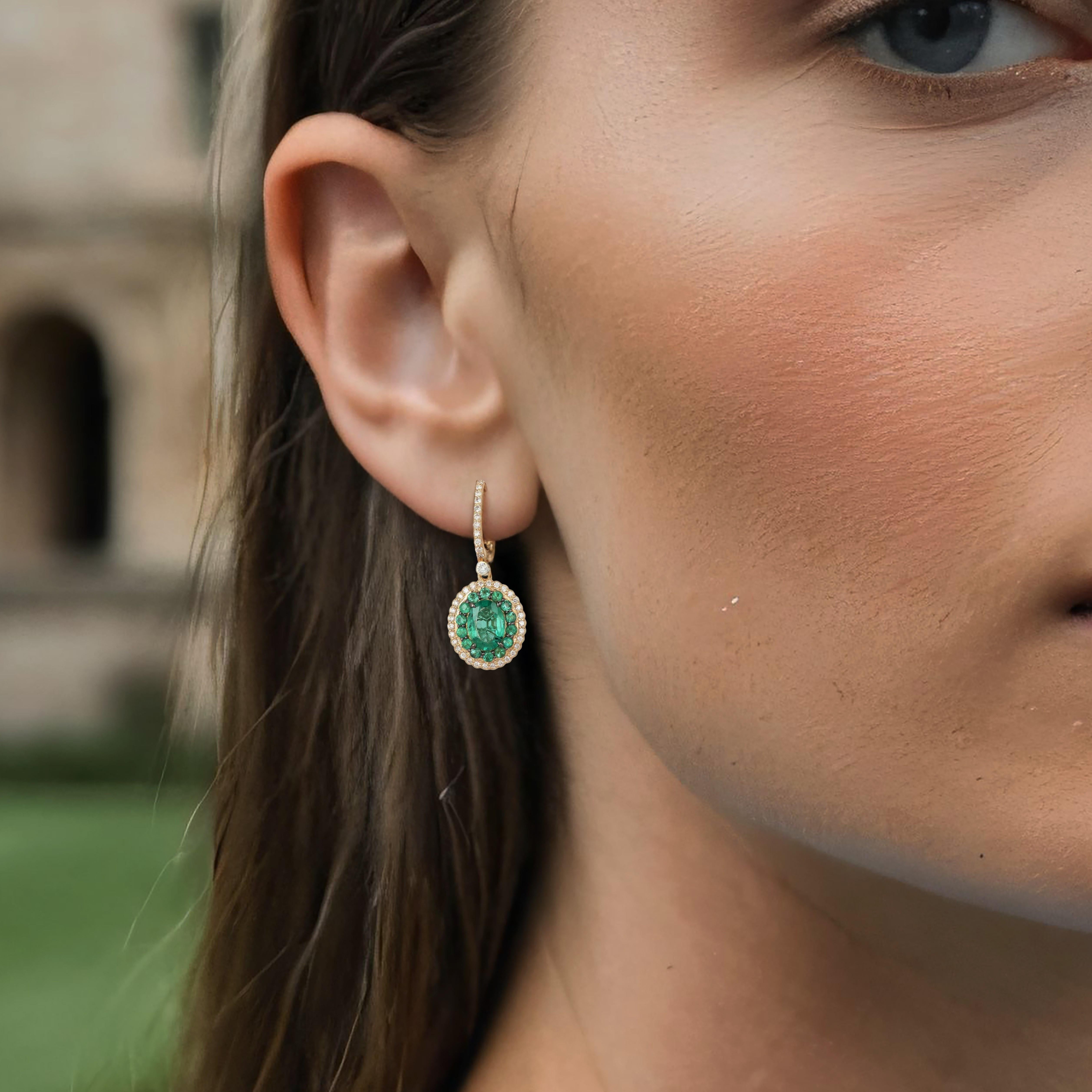 Embrace timeless beauty with the Dreams Diamond 14K Yellow Gold Radiant Drop Earrings. Crafted in 14K yellow gold, these exquisite earrings feature 0.43ct of full-cut diamonds paired with 2.45ct of vibrant emeralds. The harmonious combination of