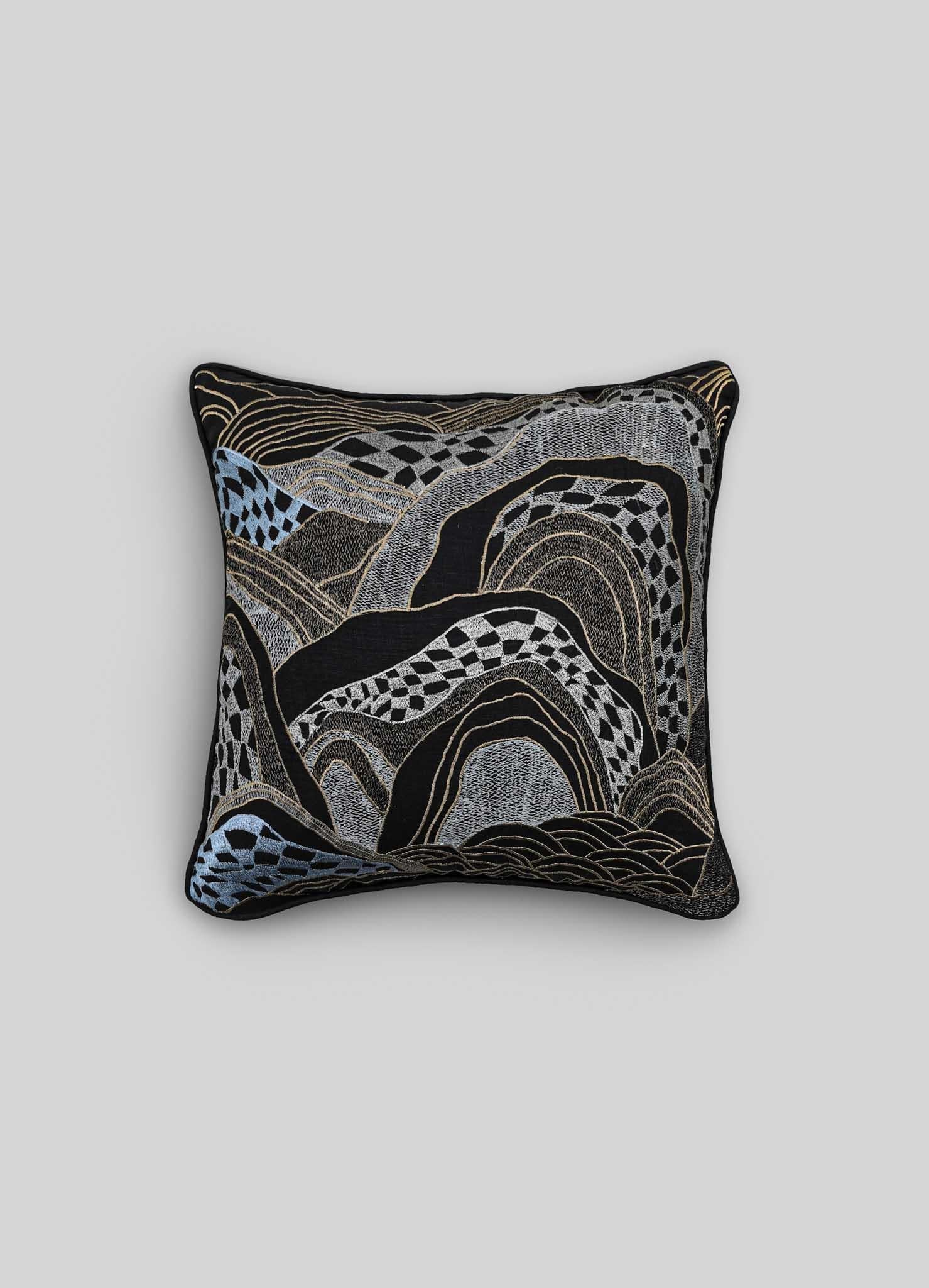 Dreamscape Black Embroidered Linen Cushion, Viya By Vikram Goyal

Behold the tangible embodiment of a reverie – a whimsical collection of textiles inspired by the 17th-century Rajput manuscript, 