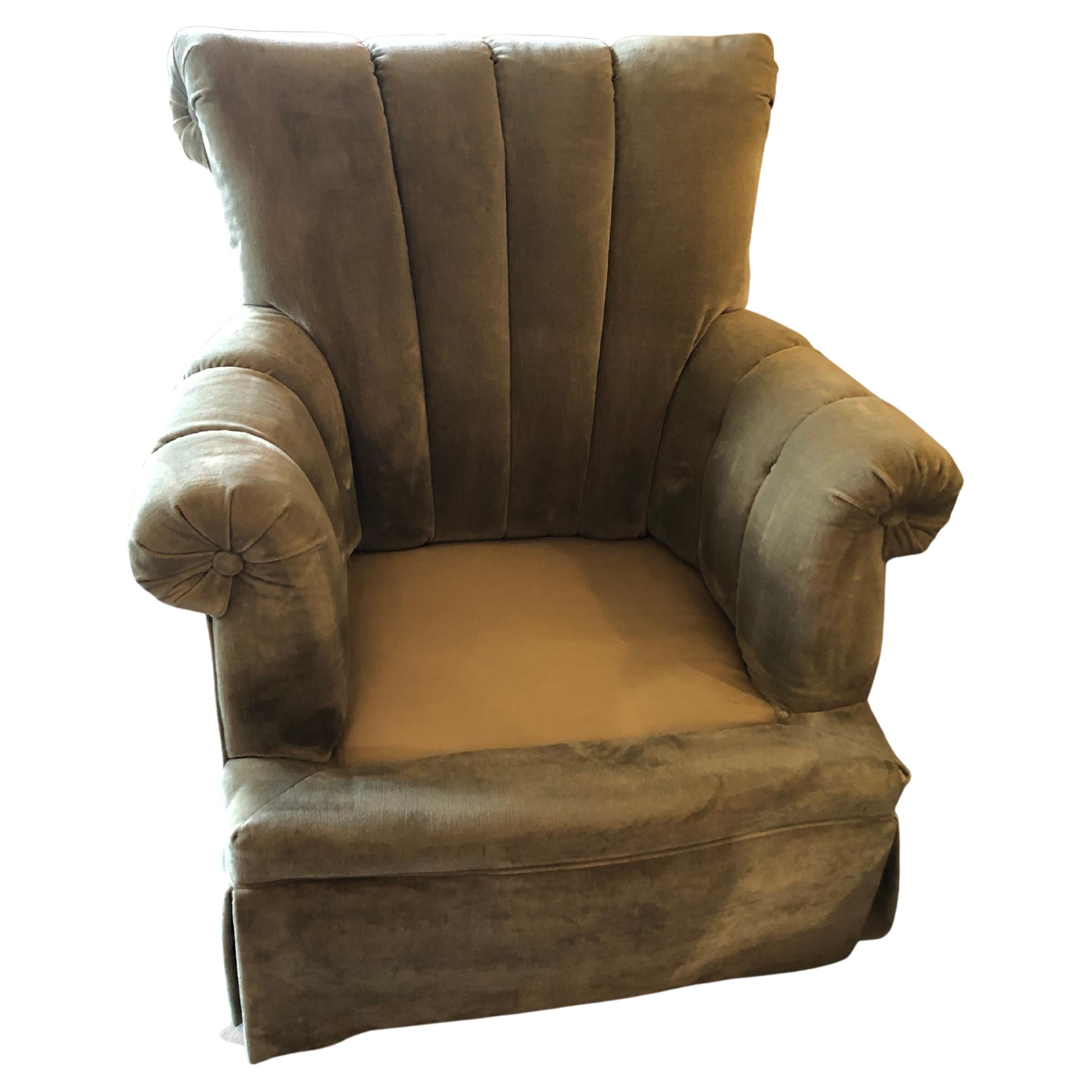 Super dreamy plush comfortable and large pair of celadon green velvet upholstered club chairs having channel backs,  scrolled arms with tufted central button, and handsome box pleated skirts.  
Arm to arm 36 w
32