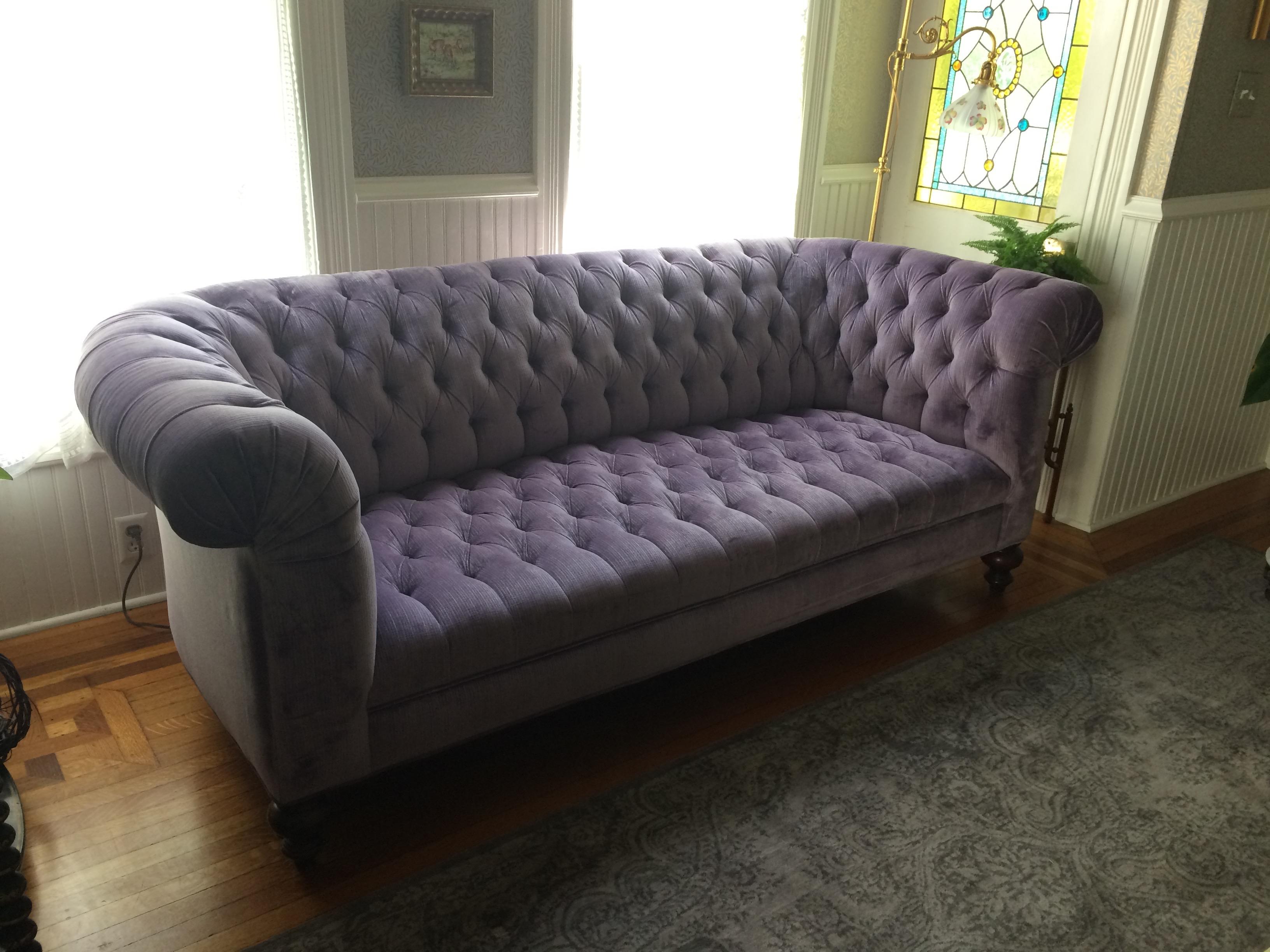 Super glamorous plush, top of the line, lavender velvet upholstered Chesterfield sofa, deep, soft, and having classic curved arms and walnut turned feet. About 5 years old.
Measures: Seat depth 22.5.