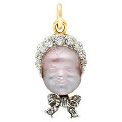 Dreicer & Co. Edwardian Diamond Carved Moonstone Platinum-Topped Baby Pendant