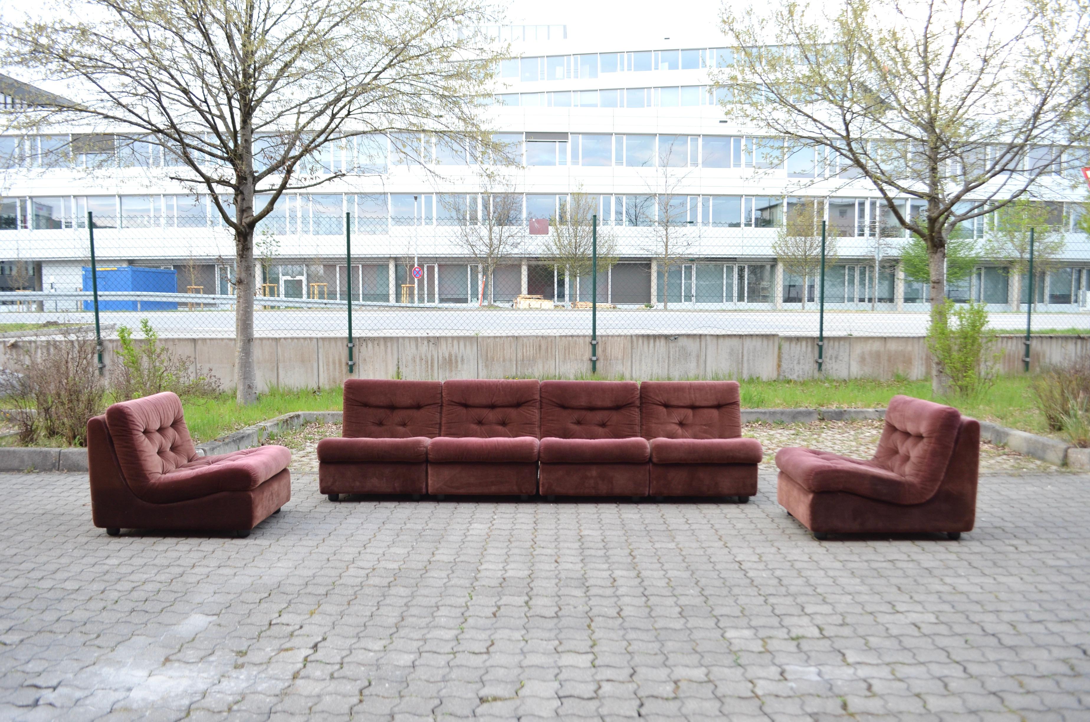 Vintage Modular Sofa consisting of 6 pieces. Manufactured by Dreipunkt International in the 1970s. 
Beautiful red-brown velour cord fabric. Can be used individually or arranged as a sofa with 4 removable armrests.
Loose cushions, very