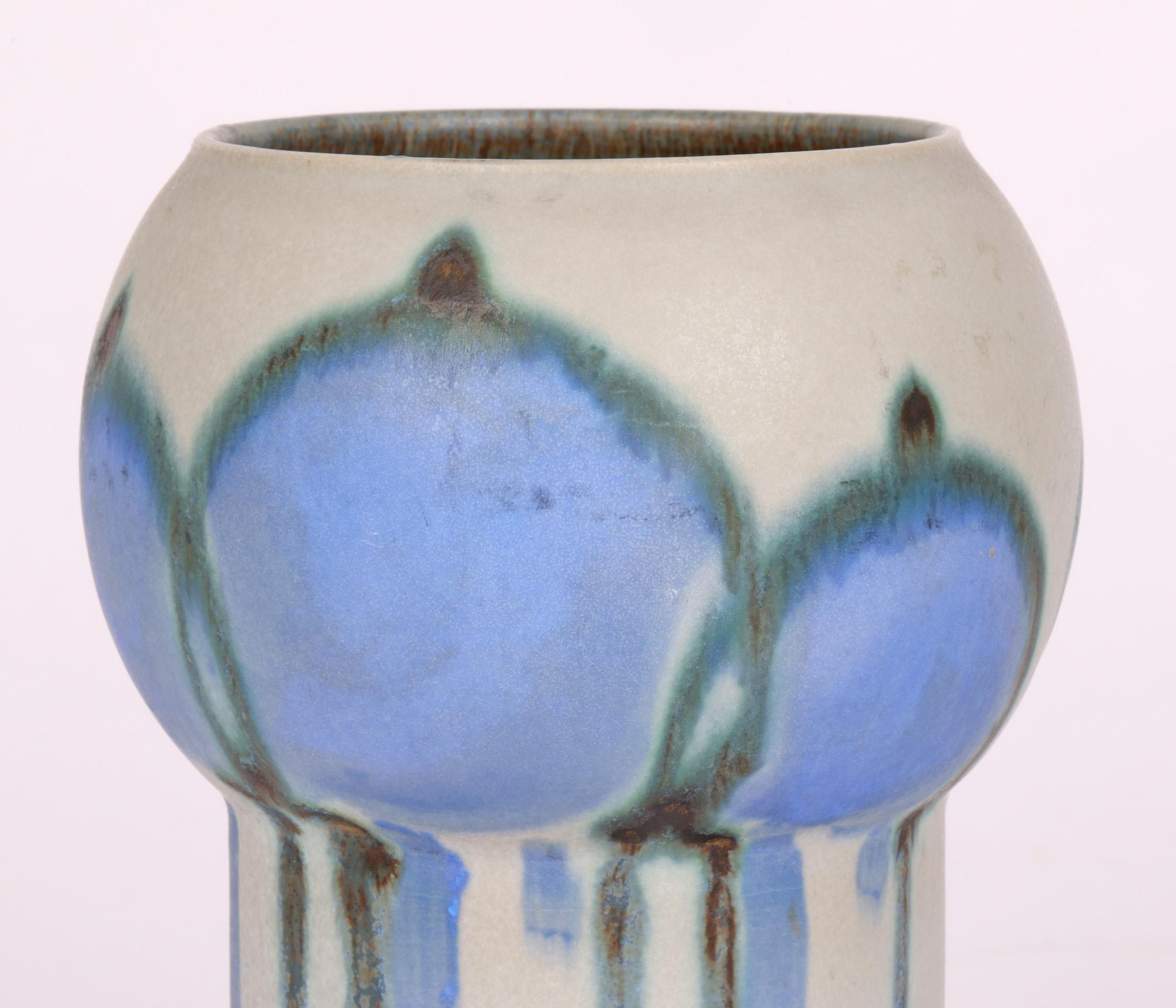 A very striking hand-made and hand decorated Swedish art pottery made by the Drejargruppen artist group for Rörstrand in 1973. The vase has a cylindrical shaped lower body with a wider round shaped top and is hand decorated with a pettern emulating