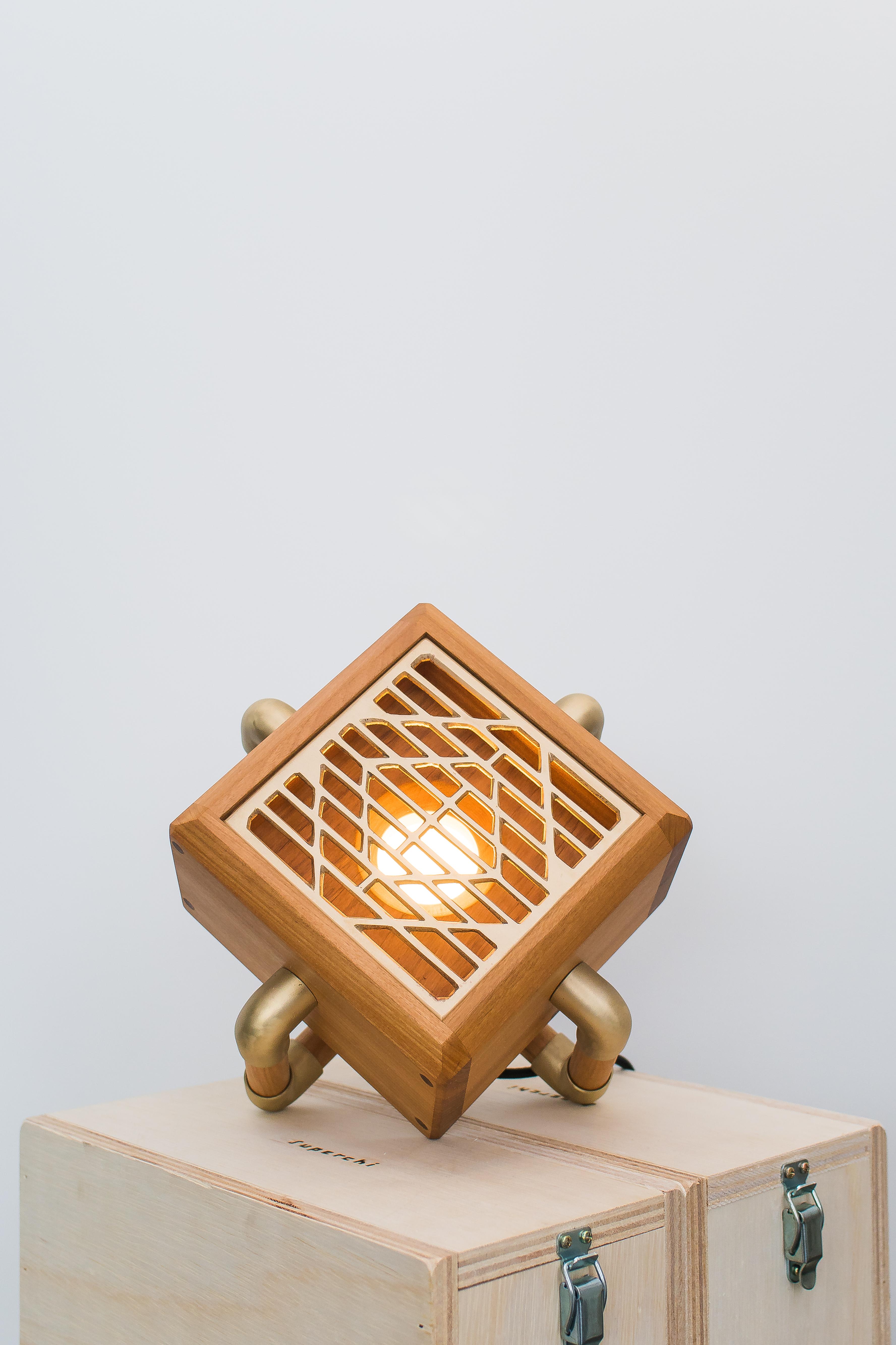 Drenare table lamp by Caio Superchi
Dimensions: D28 x W28 x H22 cm 
Materials: Solid Peroba do Campo wood + grid and brass connections + 6w led

All our lamps can be wired according to each country. If sold to the USA it will be wired for the