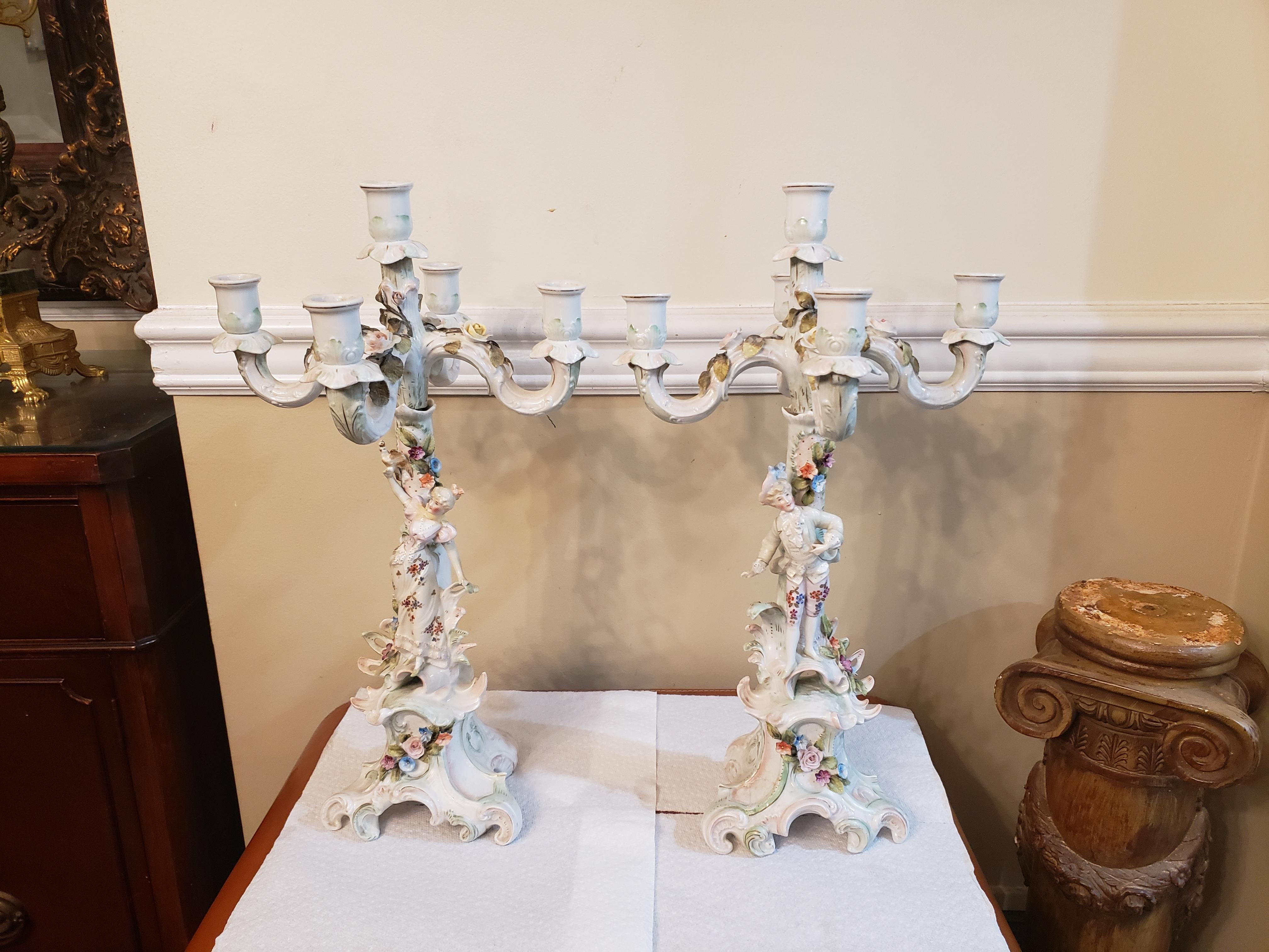 Product details

A good quality pair of early 20th century Meissen Porcelain five branch candelabra, each having wonderful floral, Roses encrusted decoration, with figures of a woman on one and a man on the other. Measure 10