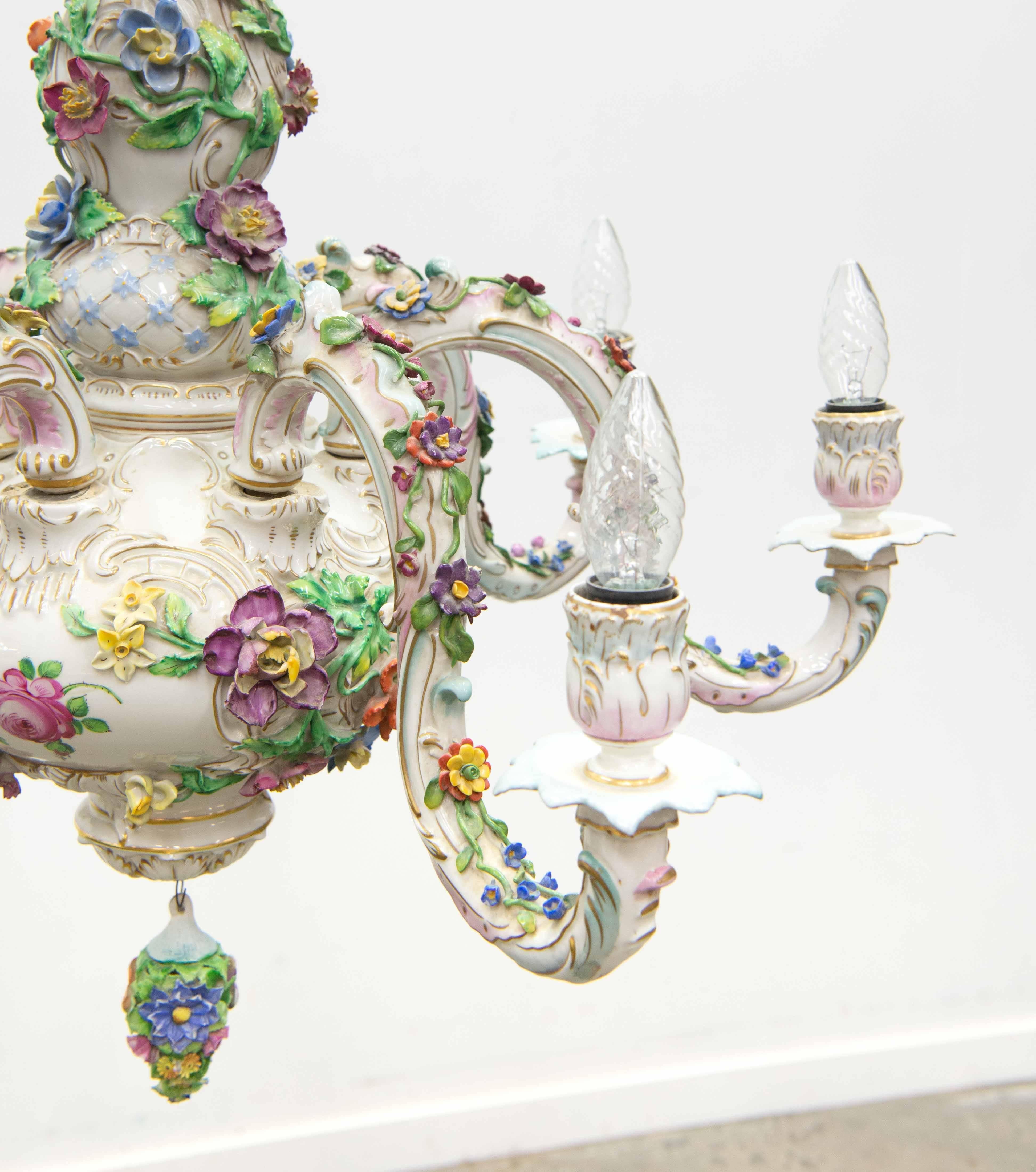Porcelain chandelier by Dresden Porcelain in Germany. Made circa 1970. 
Six points of light. Porcelain ceiling cover included. 
Light damage on some of the smaller flowers because of cleaning. Overall good condition. 

Please note: This
