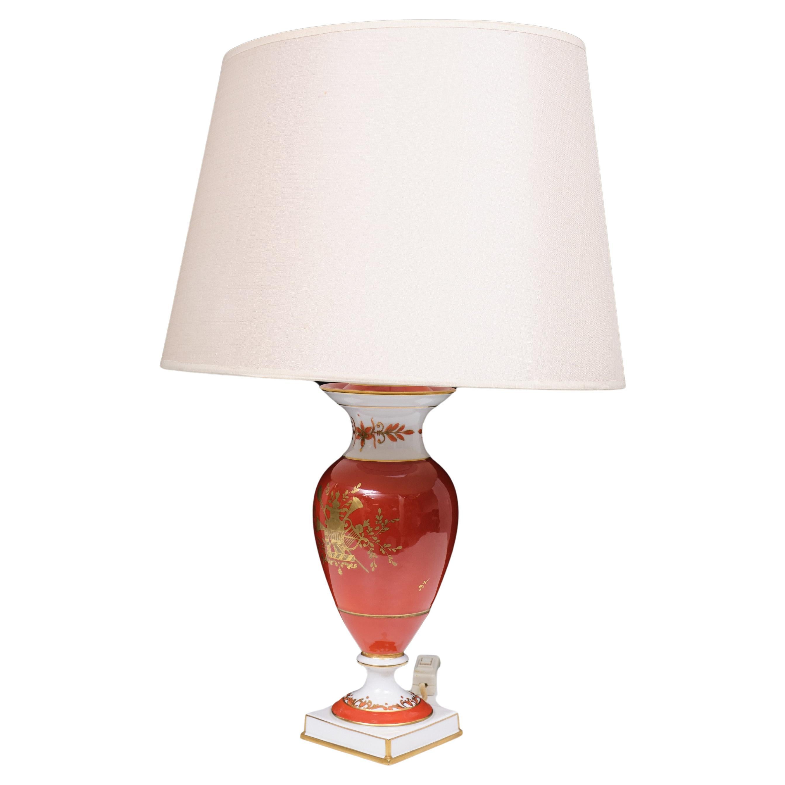 Very nice Classic table lamp ,signed Dresden porcelain . Beautiful Red  color ,
comes with gold musical medallion  in the middle . 
   