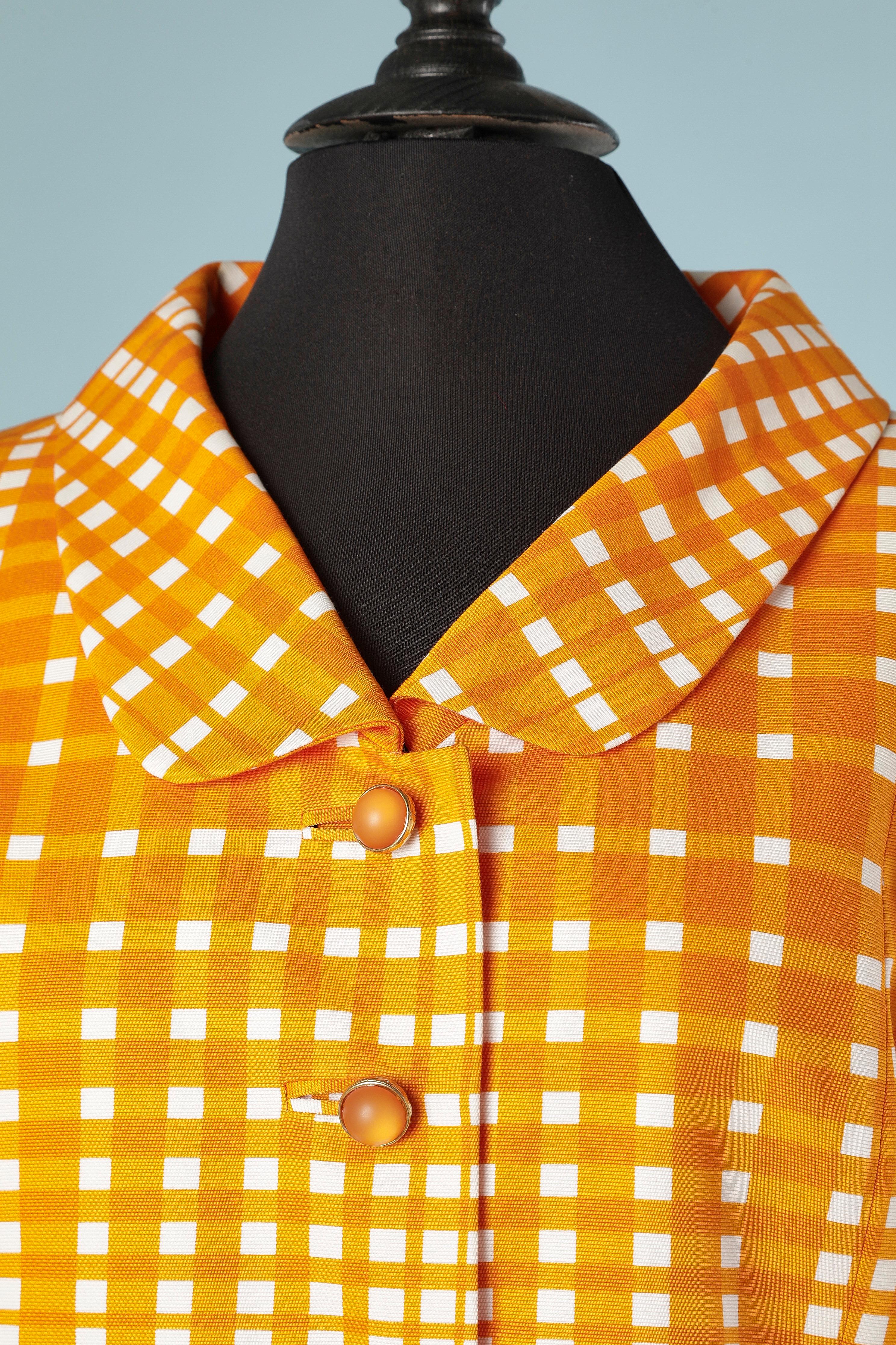 Dress and coat ensemble in white and orange check. Fabric composition: 100% cotton. Lining: 60% acetate 40% bemberg 
SIZE 38