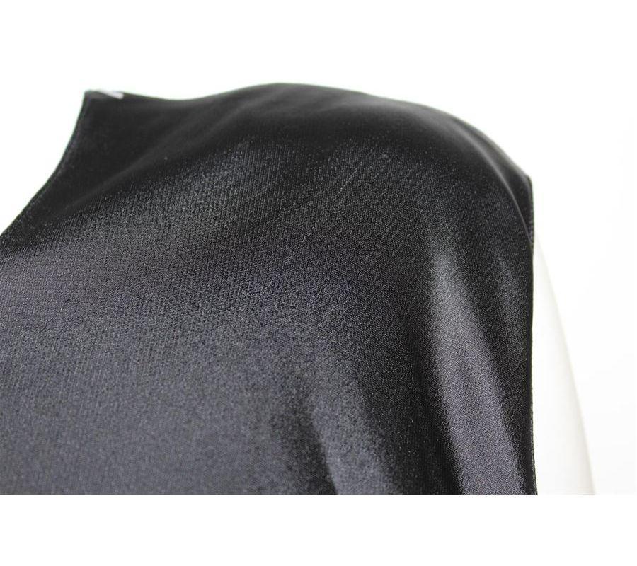 Viscose Black color One side has wide sleeve and one side is sleeveless Maximum lenght 109 Presence of some pulled wires on shoulder and on the front see pictures
