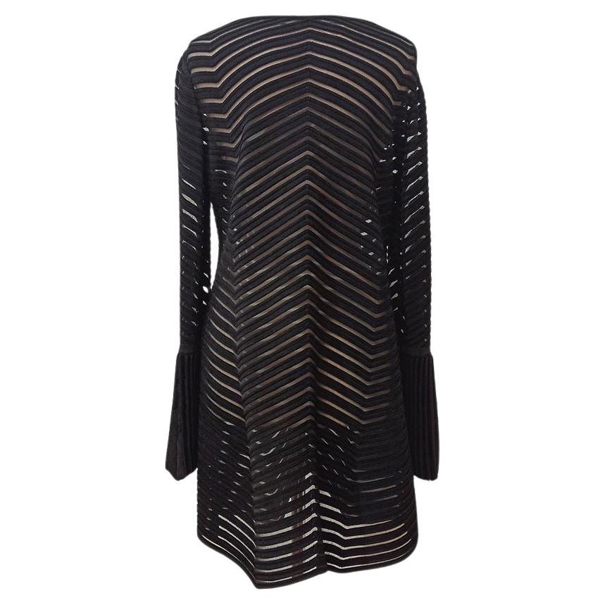 Missing compositiona and size tag Black color Long wide plissè sleeves Striped fancy that alternates velvet and tulle Round neck Maximum length cm 90 (3543 inches)
