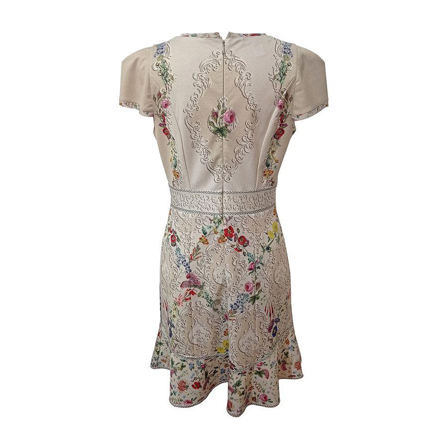 Polyester (95%) Lycra Beige color Floral print embellished with crystals Short sleeves Roundneck Maximum length cm 94 (37 inches) Shoulders cm 32 (1259 inches)

