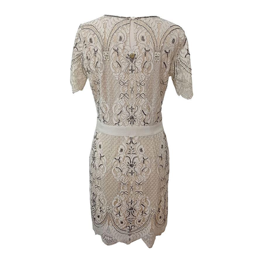 Cotton (42%) Polyamid (39%) Polyester (17%) Viscose Ivory color Lace embellished with sequins Short sleeves Roundneck Maximum length cm 94 (37 inches) Shoulders cm 36 (1417 inches)
