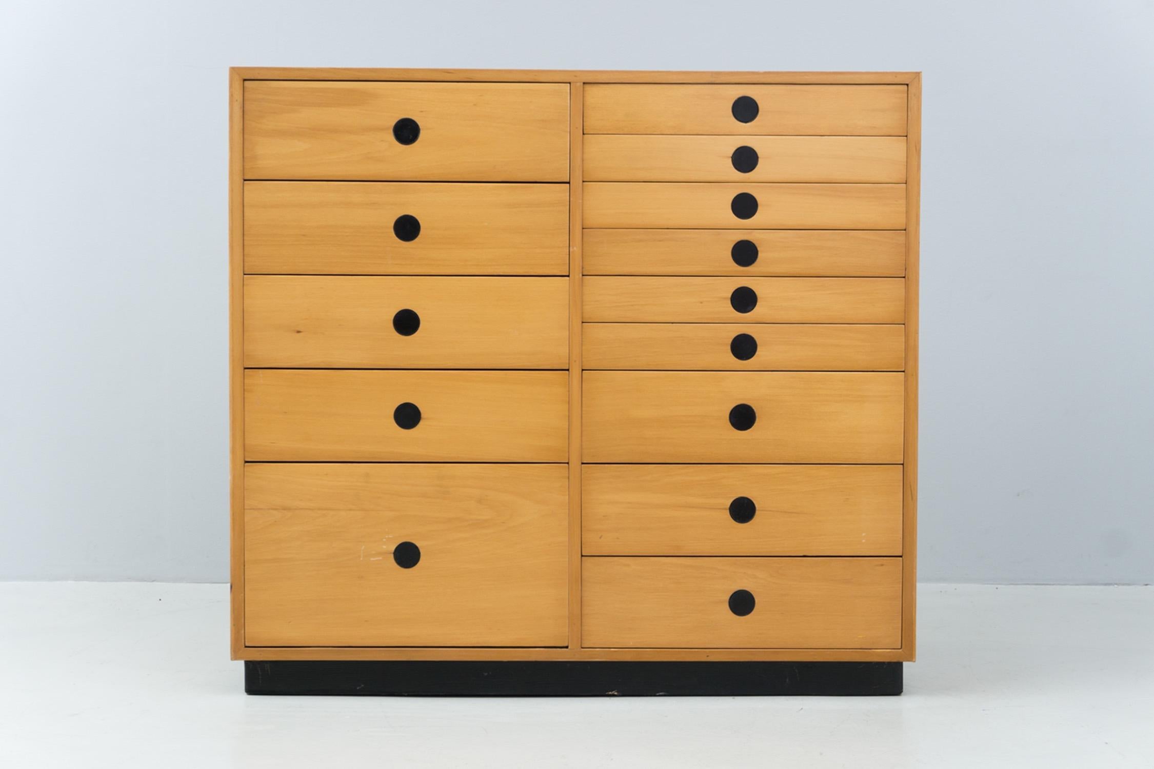 Chest of drawers with various drawers in different sizes. Made of solid ash wood and ash veneer. Black metal base, black metal handles.
Manufactured by Arform, Italy, 1959

'Paolo Tilche
(1925 – 2003) Born in Egypt, he graduated from the