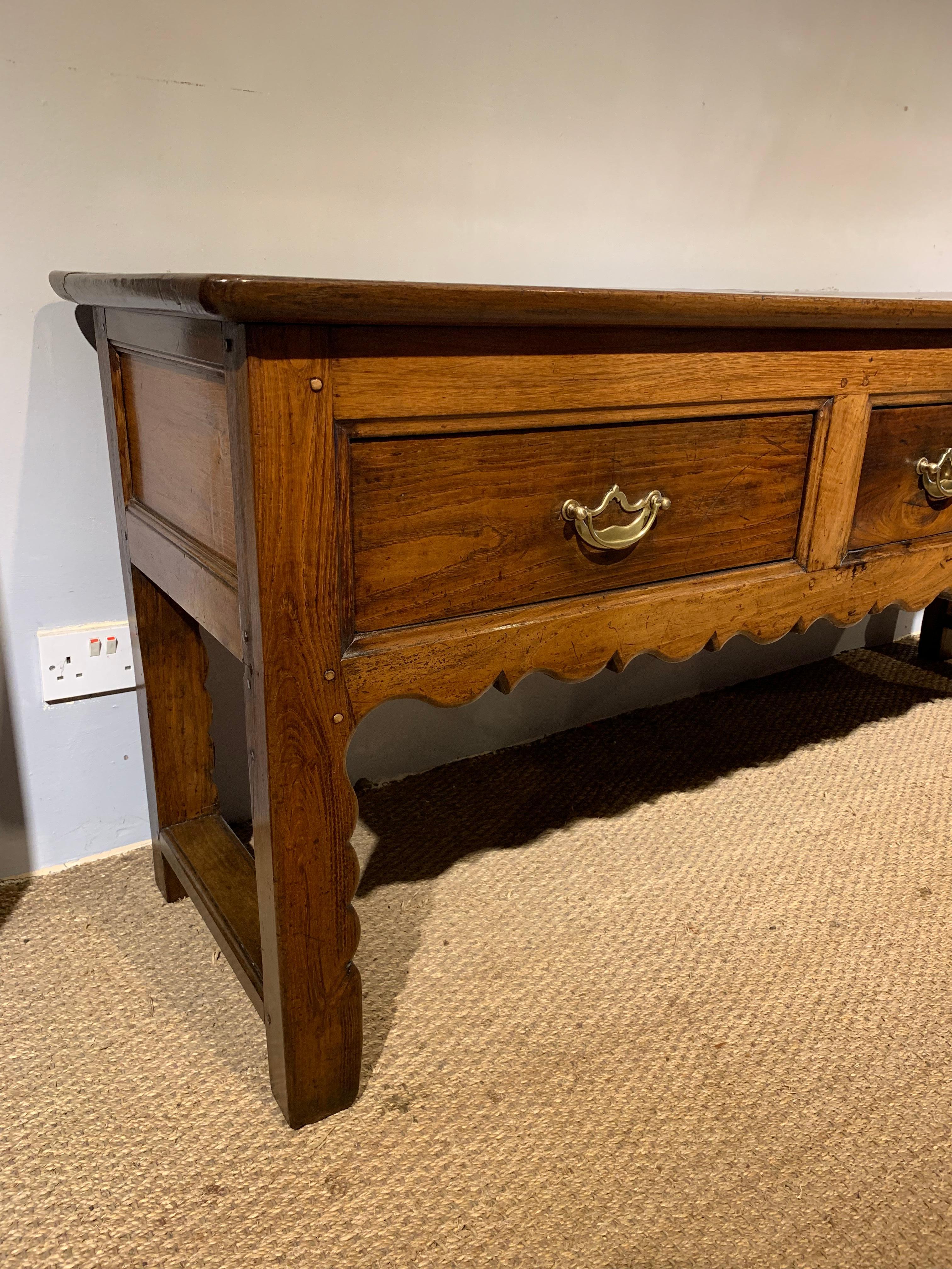 Fab early 19th century chestnut dresser base / server
From the Brittany area of France dating to around the 1840s
This piece has been through our workshops been cleaned and polished and is ready to be placed in your home
Later brass