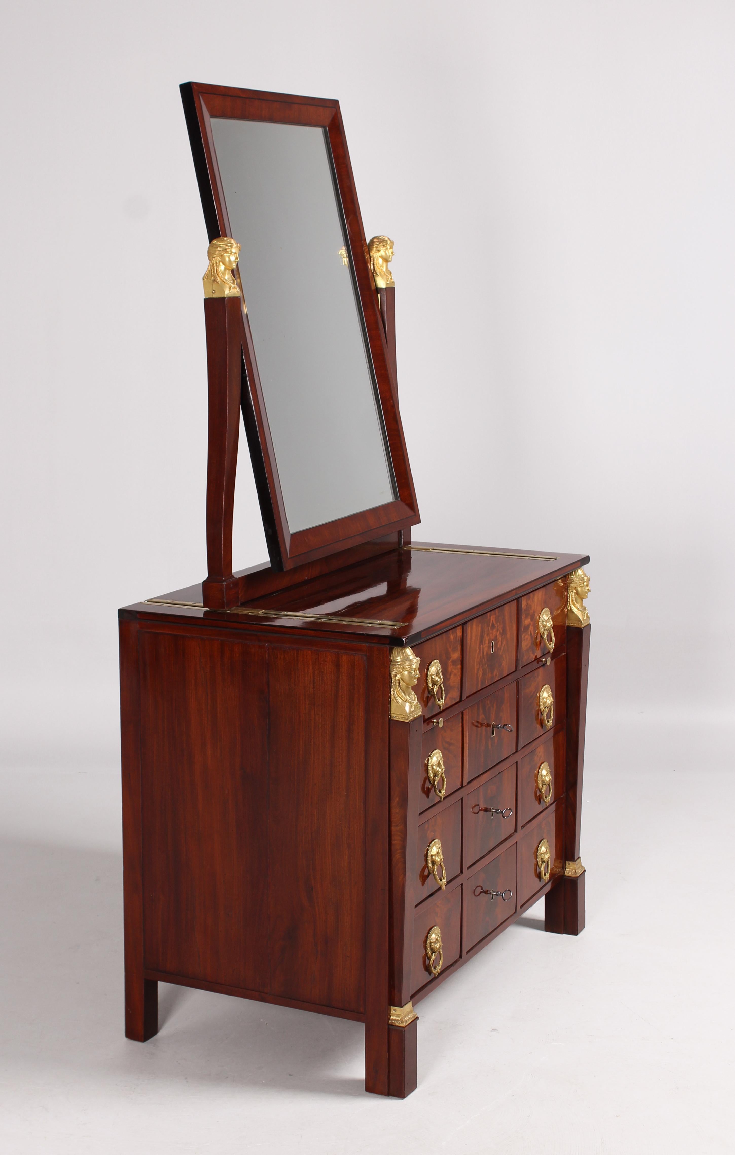 Antique dressing table - stamped Chapuis
Brussels
Mahogany
Empire around 1810

Dimensions: H x W x D: 178 x 91 x 56 cm, height without mirror: 82 cm

Description:
Elaborately crafted early 19th century dressing table from the workshop of Jean-Joseph