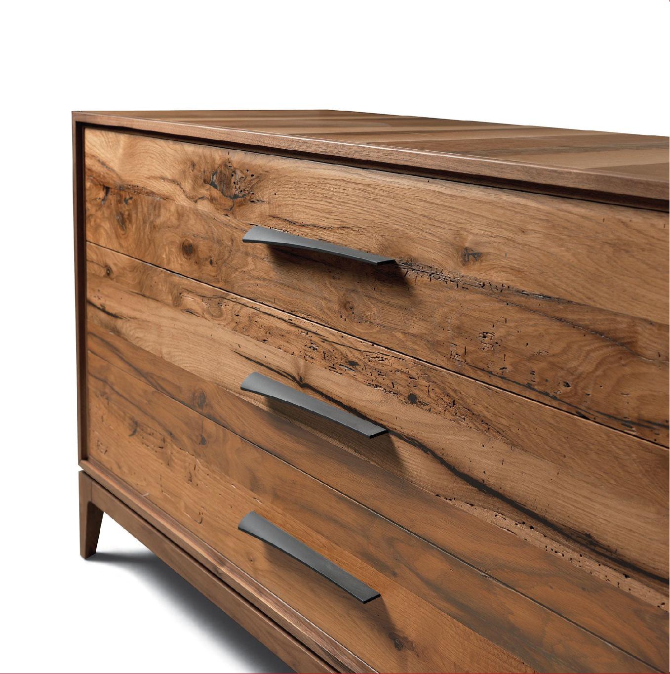 A high-end contemporary dresser crafted in Italy.
Enhancing the grain of the premium walnut, the precise oil finish is the result of craftsmanship exacted by hand.
The three drawers are in solid old oak with oil finish while the original form of the