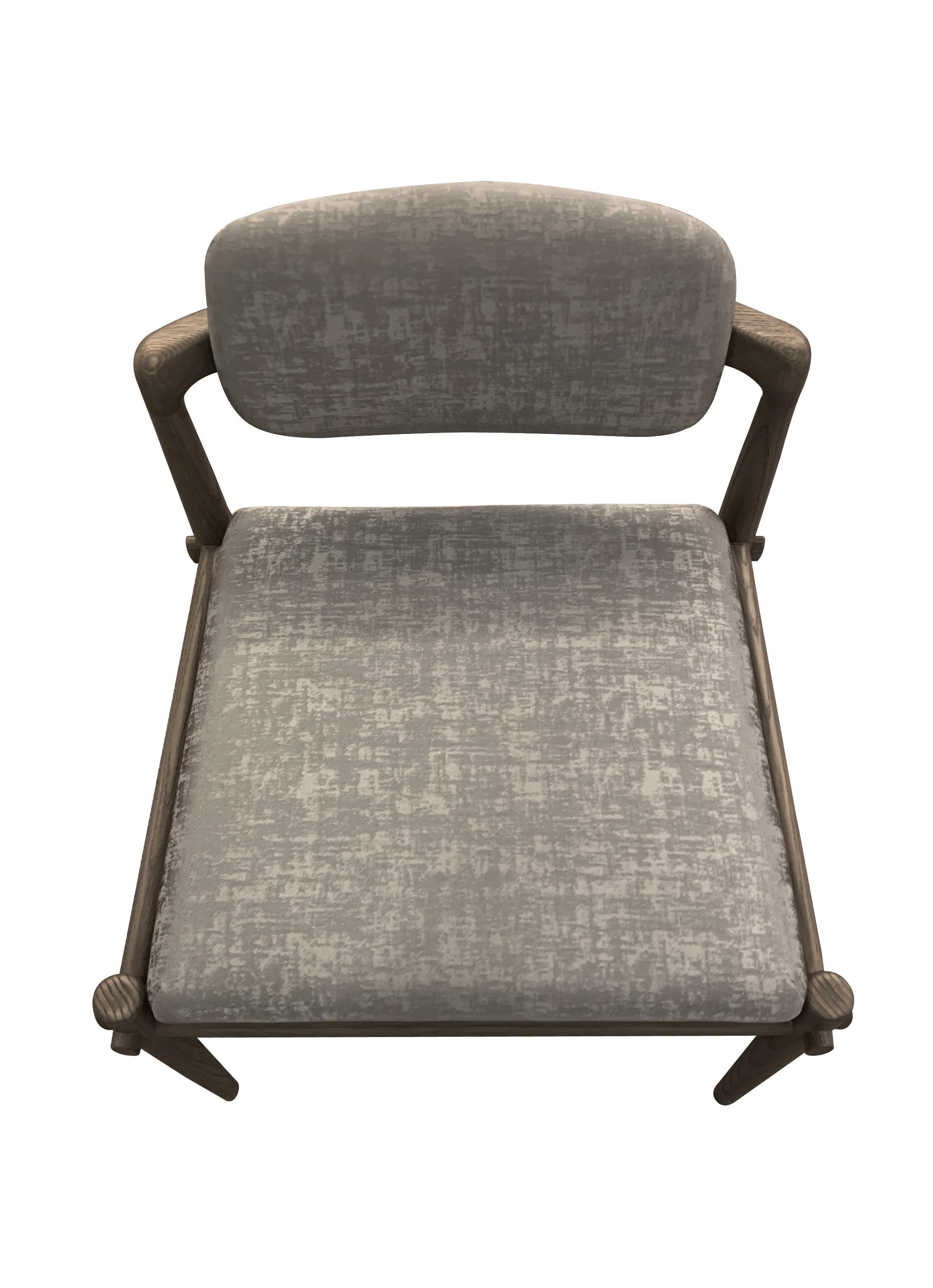 Description: Dressing chair
Color: Grey and travertine grey
Size: 58 x 49 x 60 H cm
Material: Oak and fabric
Collection: Interlock

Dressing chair, grey oak wood upholstered with travertine grey fabric.
Solid oak and handmade.
Available upon