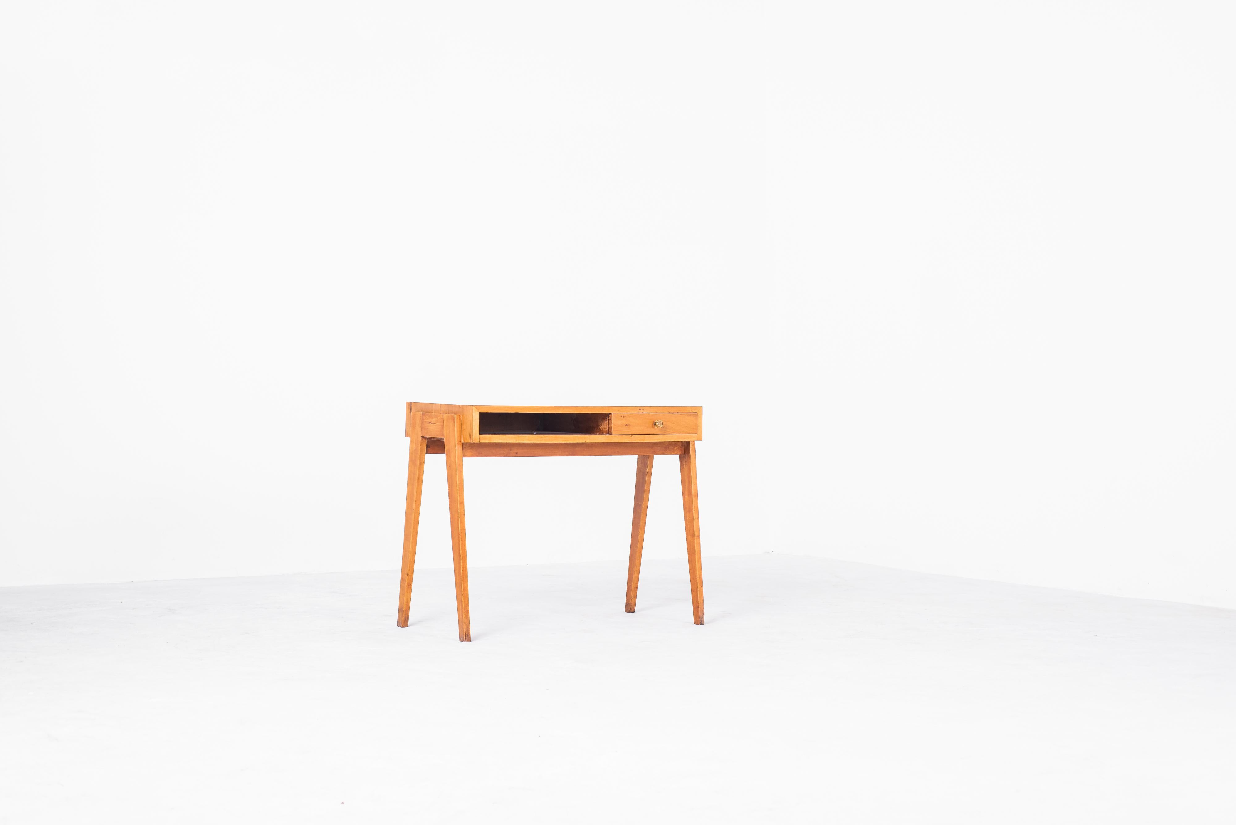 
The Dressing Desk by Lina Bo Bardi is a minimalist and functional piece of furniture that is both iconic and versatile. Designed in 1949, it is considered to be a very important piece of Brazilian modern furniture. The desk is made of peroba wood