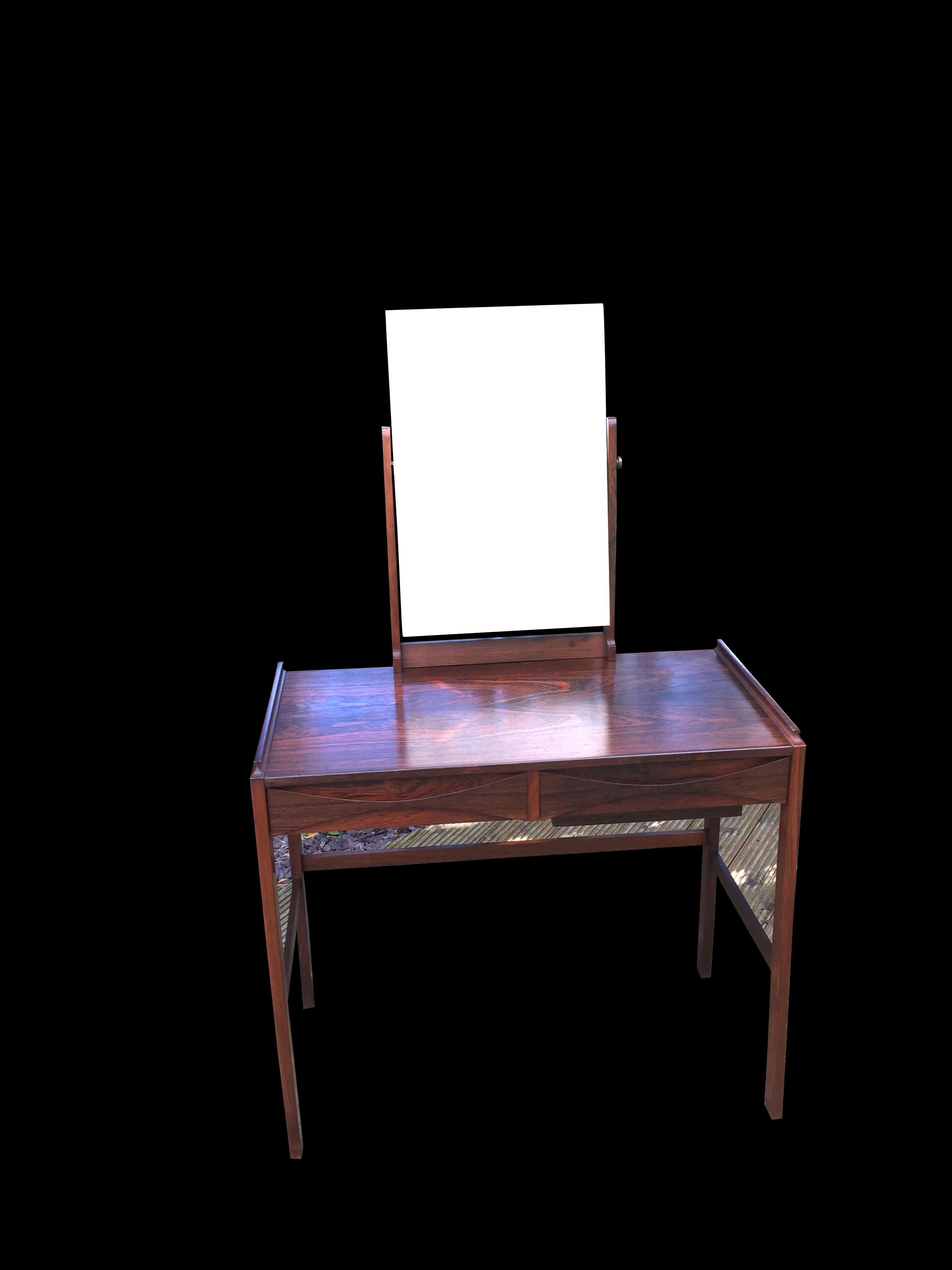 A very nice little dressing table with adjustable mirror, on two drawer base, the right hand drawer concealing a well for make up.
All in very nice original condition.