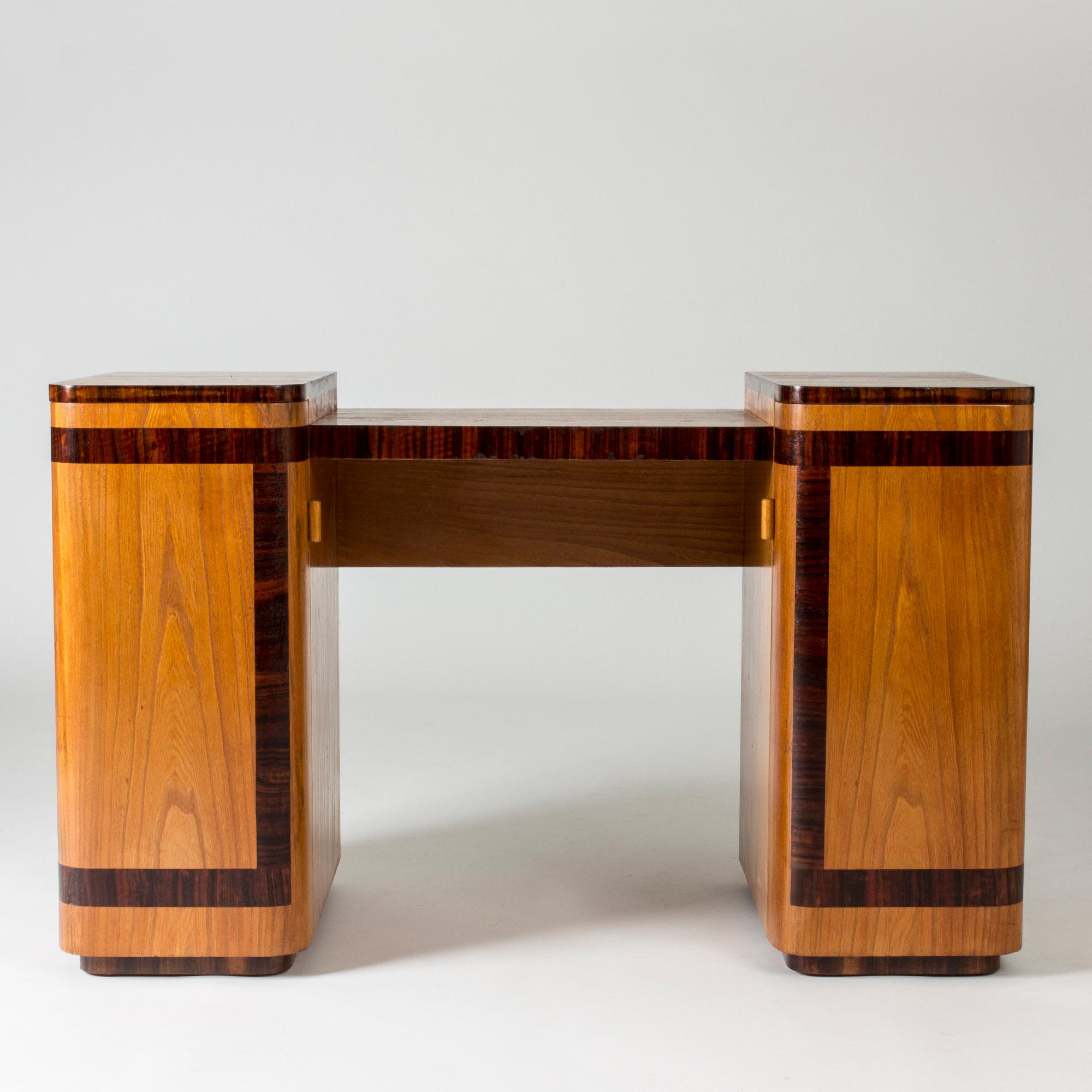 Amazing functionalist dressing table by Axel Einar Hjorth. Made from elm with contrasting inlaid darker wood. The rounded forms of the sides come together beautifully with the clean, strict decor.