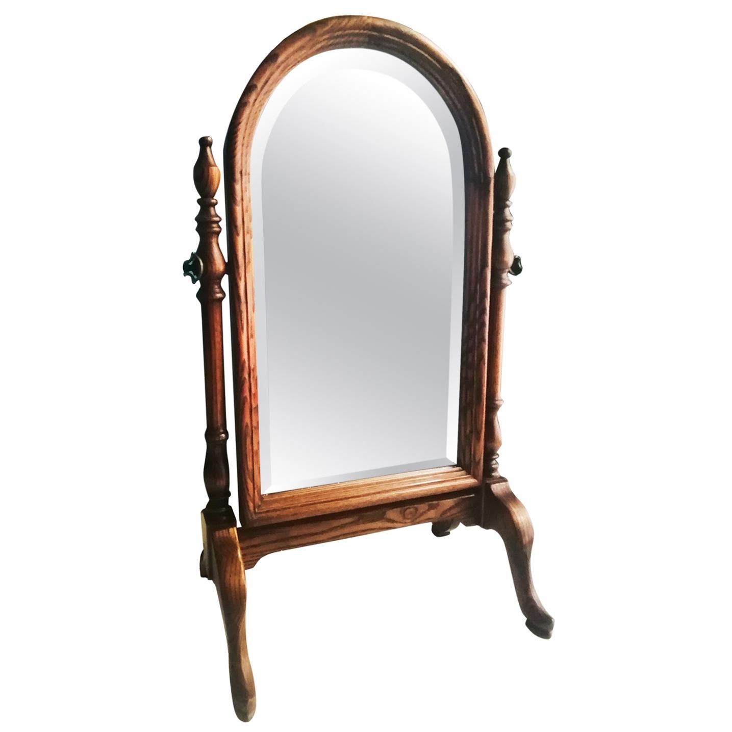 Wood Wanity table mirror or dressing mirror, early 20th century

Vaniity or dressing table mirror 
Beautiful folding mirror, to put on top of a table or console. It is a beveled mirror with a semicircular shape at the top, it is foldable and it is