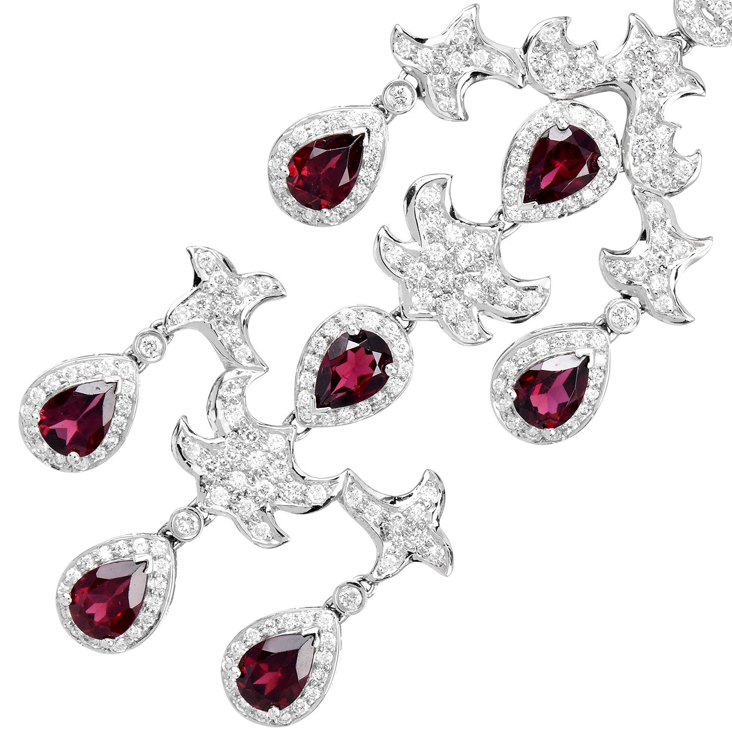 Estate floral open-design large dangle earrings, perfect for any Special Occasions.

These chandelier earrings are Crafted in solid 18K white gold and set with  (16) Red Garnets, pear-shape, and prong set, weighing a total of approximately 11.00