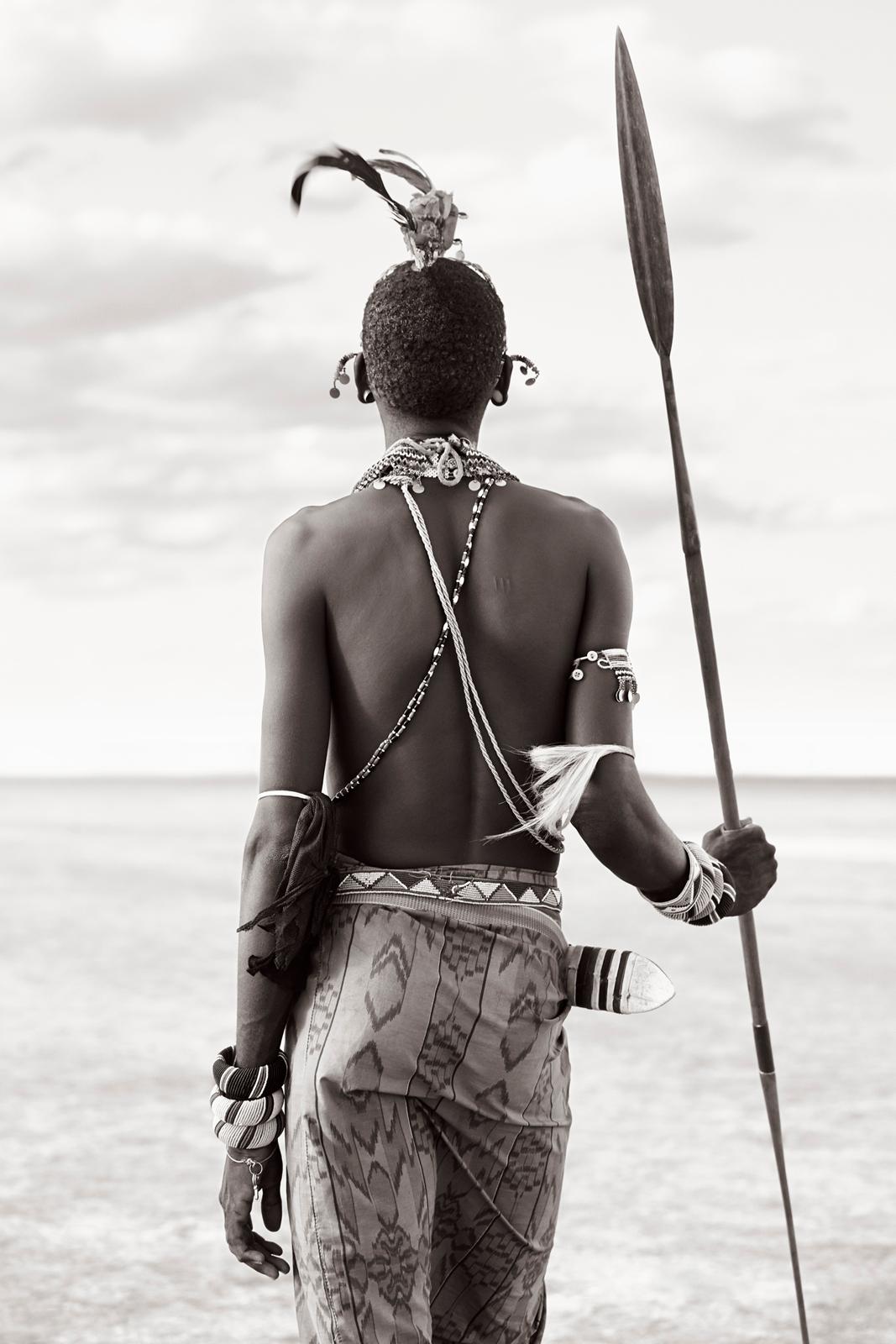 A Rendille warrior leaning on his spear in the desert of Nothern Kenya