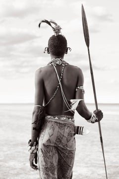 A Rendille warrior leaning on his spear in the desert of Nothern Kenya