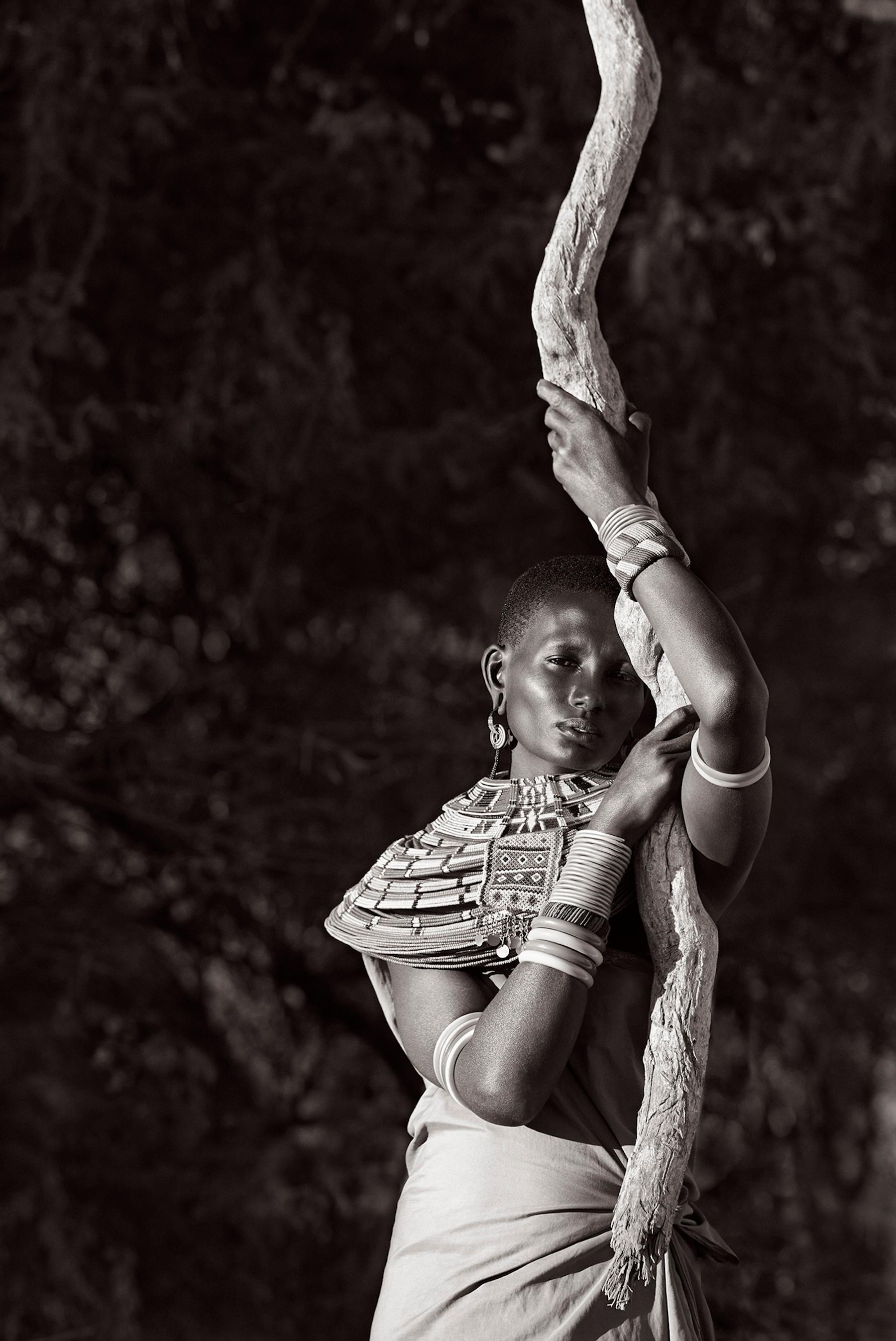 A Samburu woman is the subject of this classic fashion-inspired, black and white - Photograph by Drew Doggett