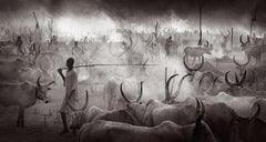A young boy walks in the dusty cattle camps of the Mundari in South Sudan