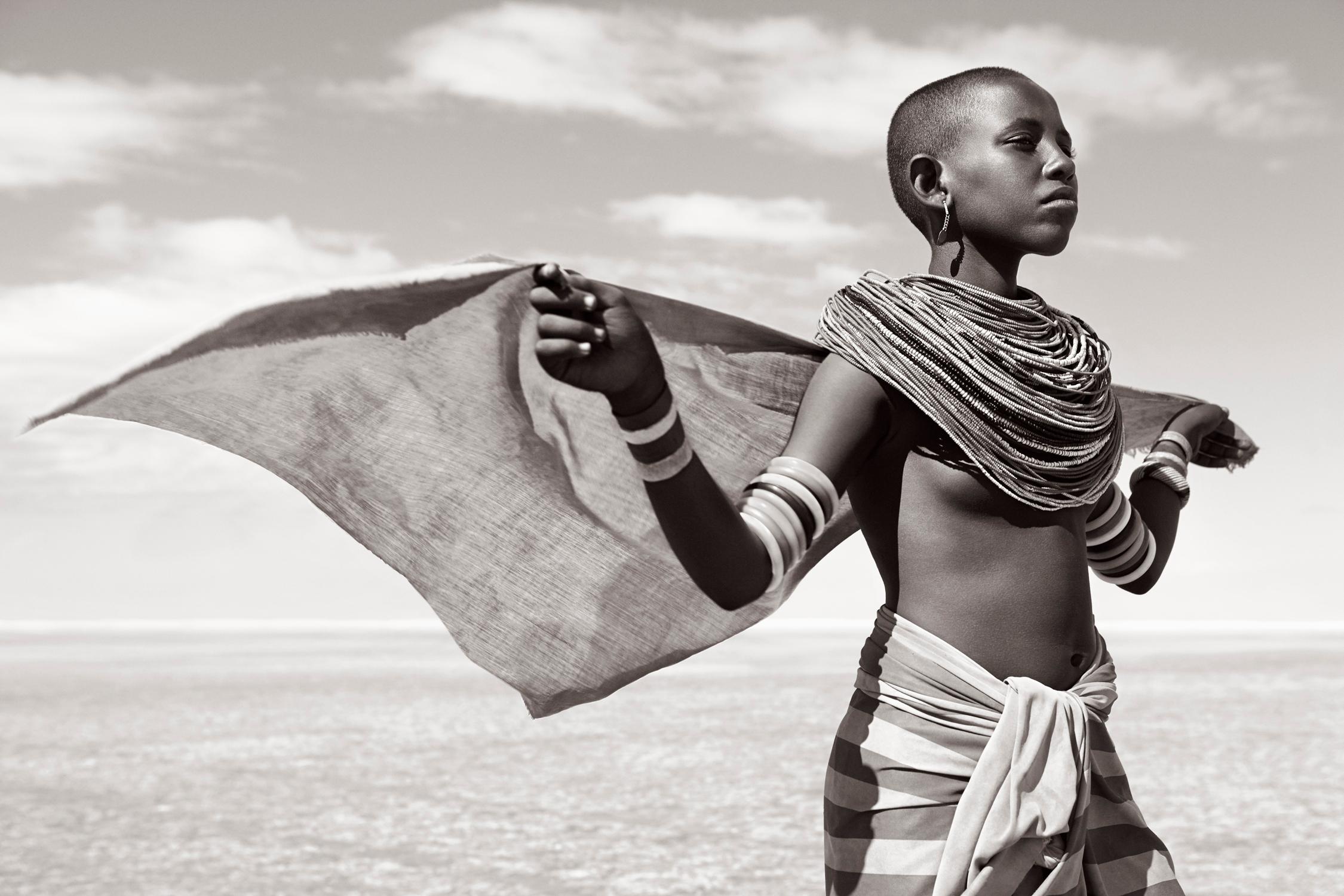 Drew Doggett Black and White Photograph - Adato, a young Rendille woman, is featured in this fashion-inspired portrait