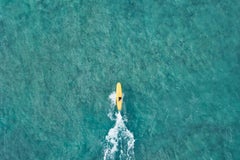 Aerial image of a surfer on a yellow board