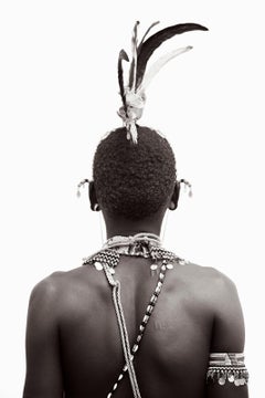 Black and white portrait of the back of a young Rendille warrior wearing traditi