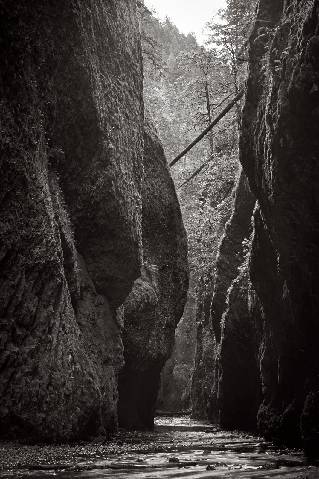 Drew Doggett Black and White Photograph - Black & White Image of a Water Flowing Through a Gorge, Classic, Minimalist