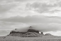 Clouds around a rock formation in Monument Valley, Utah