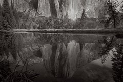 El Capitan reflected in a still pool of water