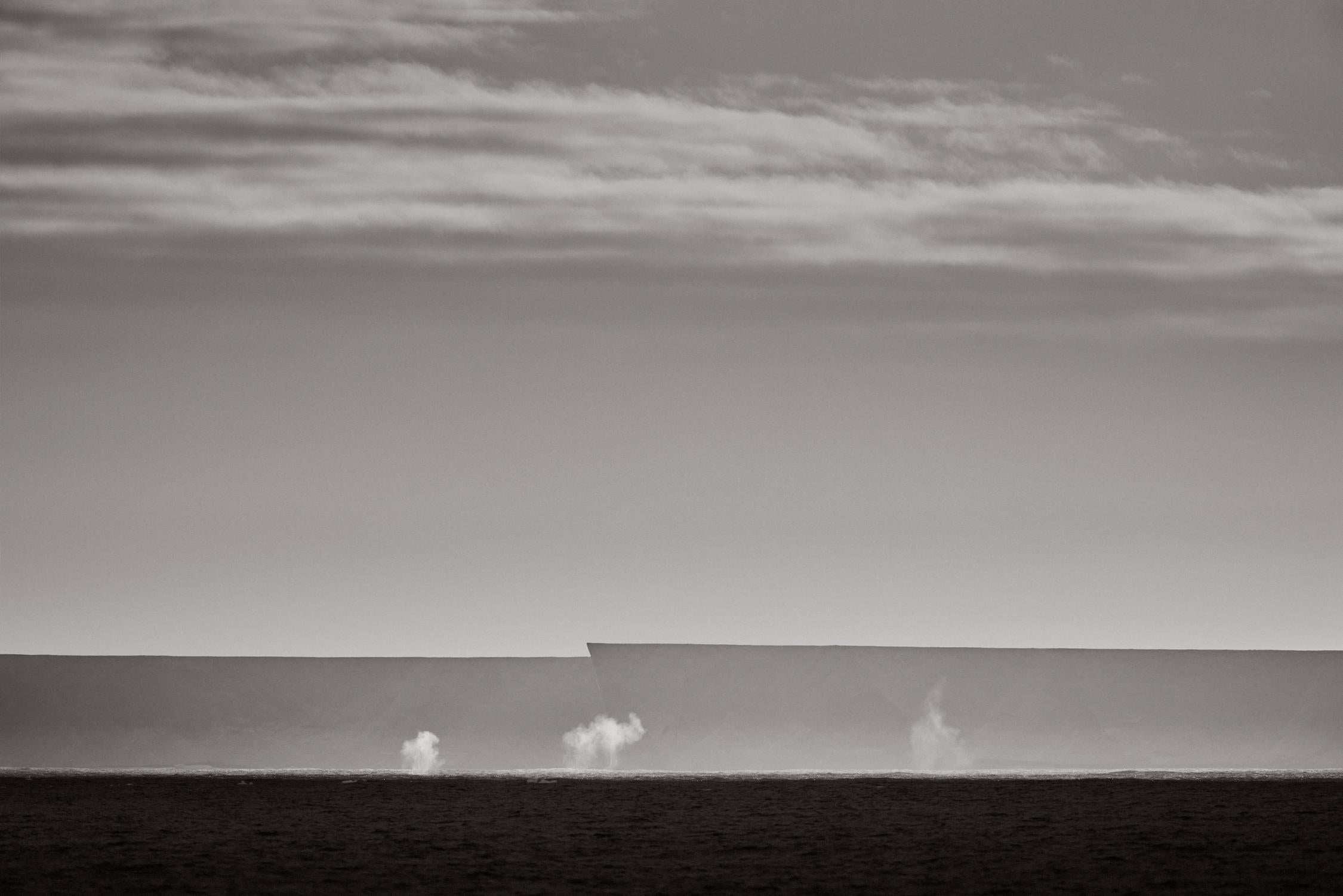 Minimal and surreal black and white capture of the world's largest iceberg, A23a - Photograph by Drew Doggett