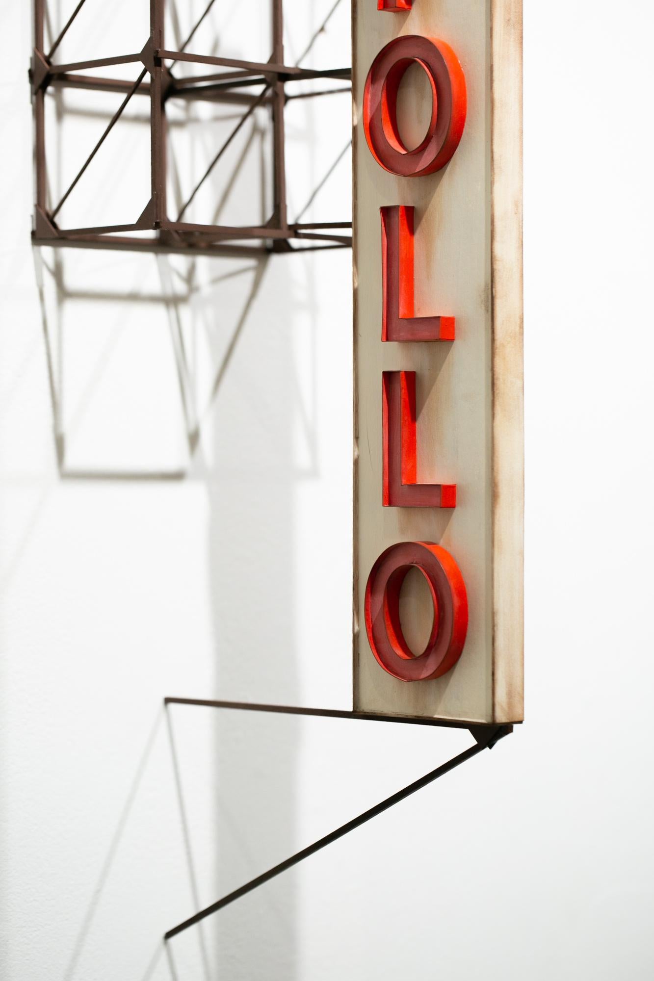 This red and beige sculpture titled 