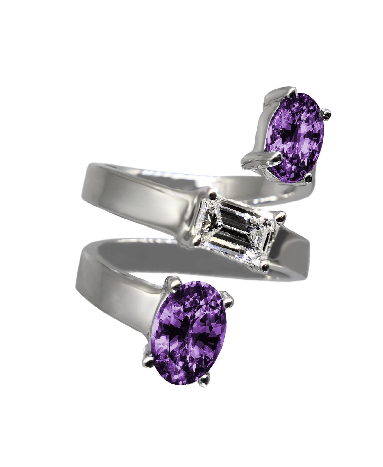 An exceptional and impressive ring by the American high jewelry designer, Drew Pietrafesa. Mounted in 18K white gold, a VS quality emerald-cut diamond is joined by two purple oval amethyst gemstones. This snake ring will wrap your finger in