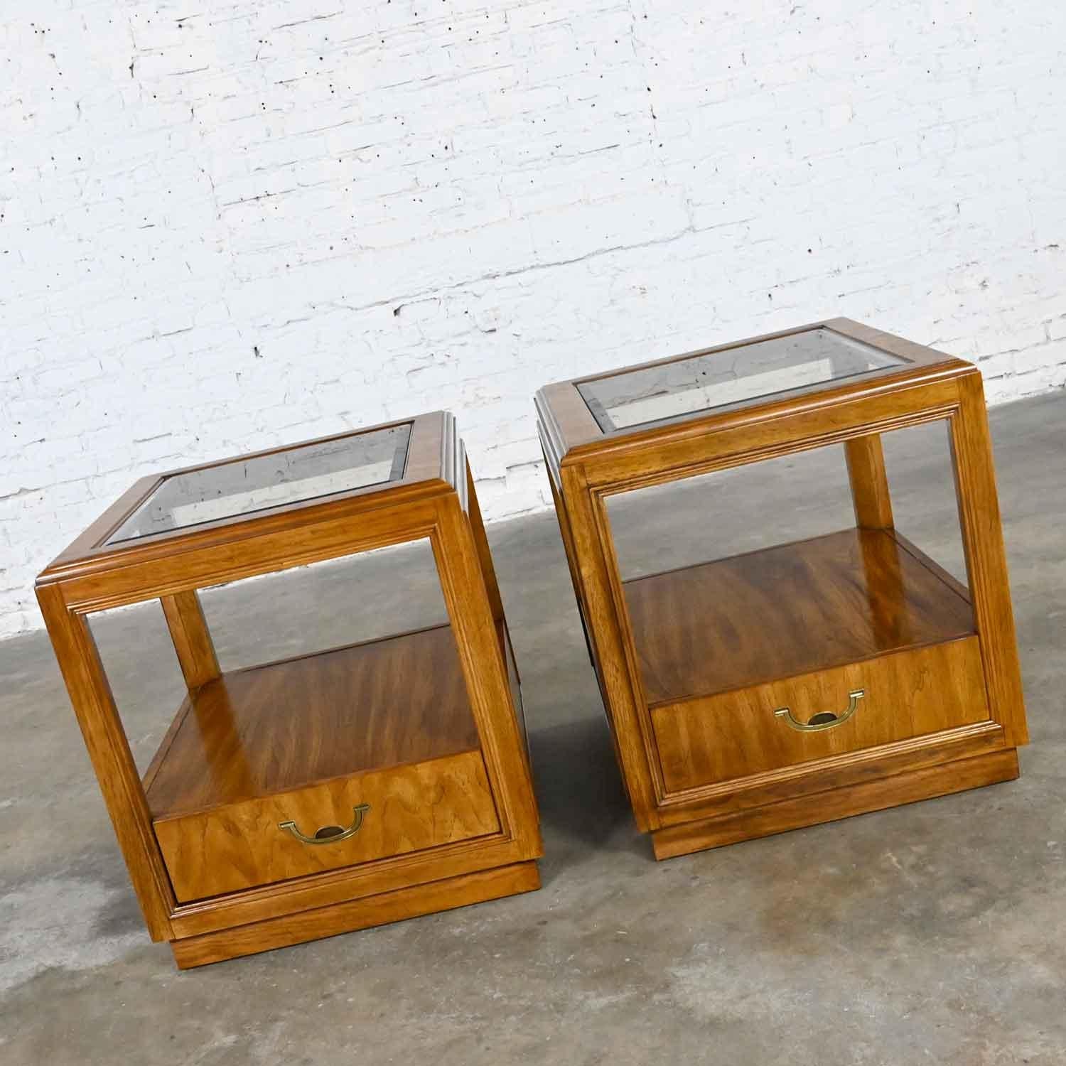 Gorgeous vintage Drexel Accolade II Collection Campaign style rectangular wood end tables with a single drawer, brass plated hardware, and beveled glass inserts. Beautiful condition, keeping in mind that these are vintage and not new so will have