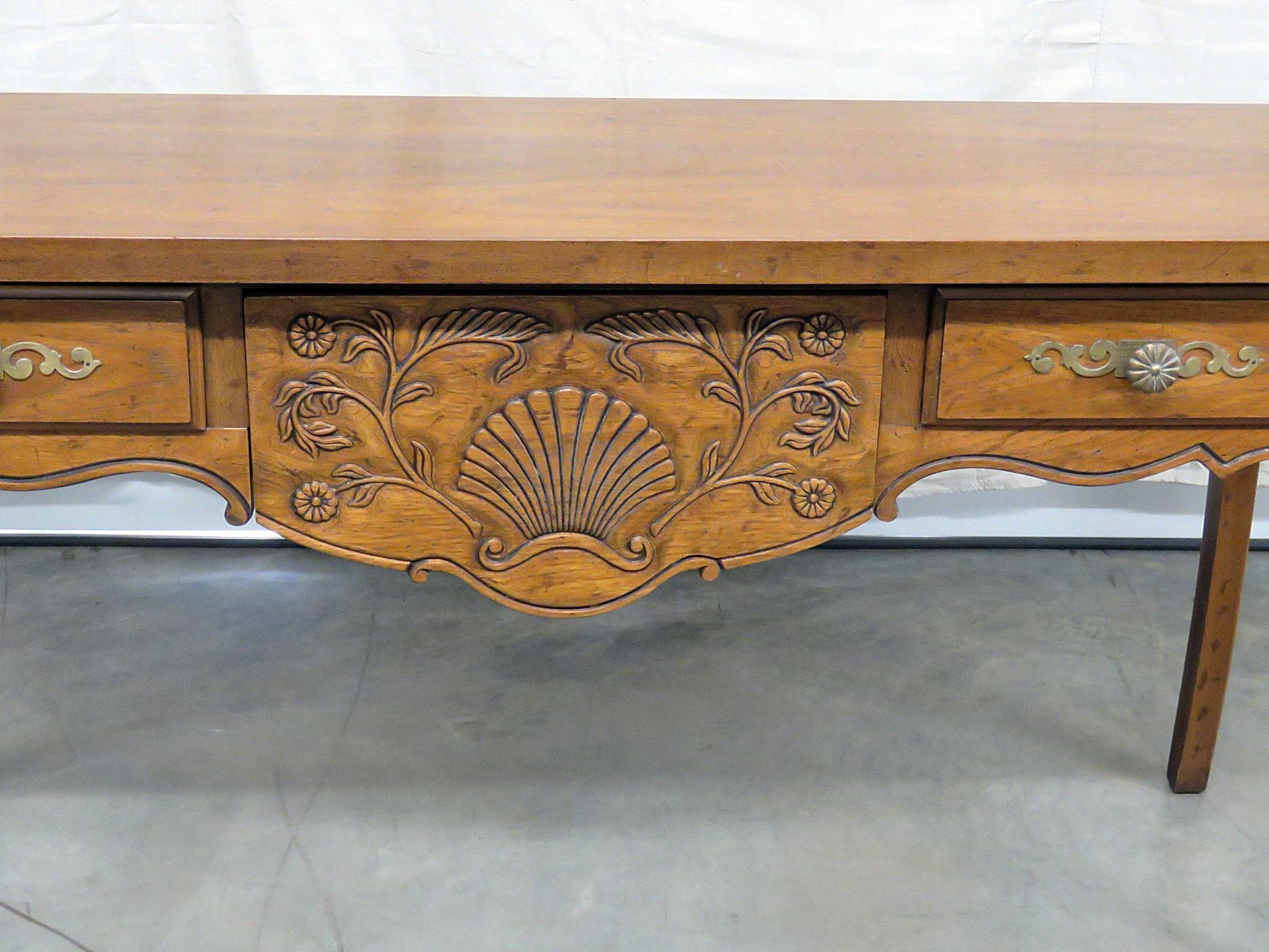 Drexel Bonaventure Country French 2-drawer console table with a distressed finish.