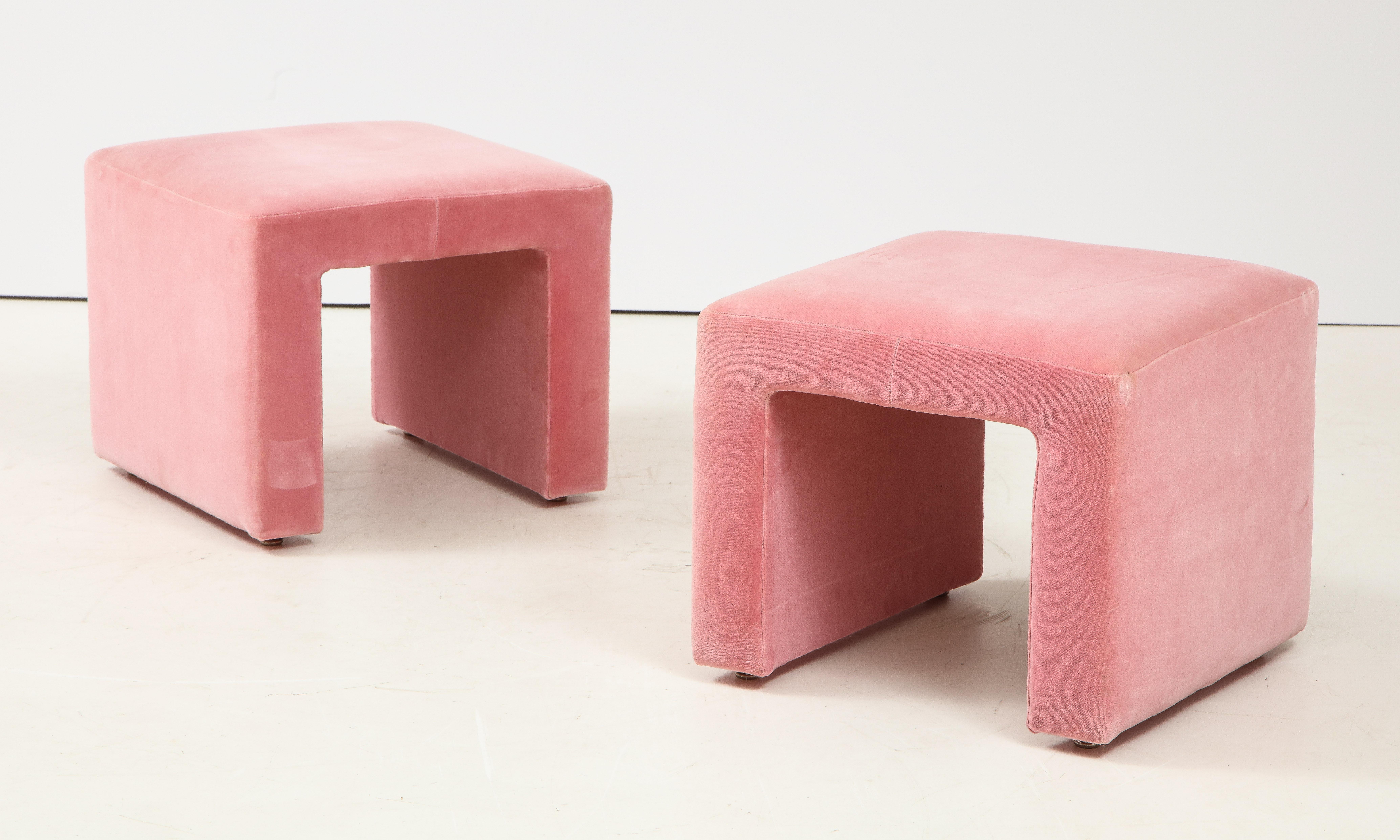 Pair of Hollywood Regency ottomans in a cheerful bubble gum pink cotton velvet.