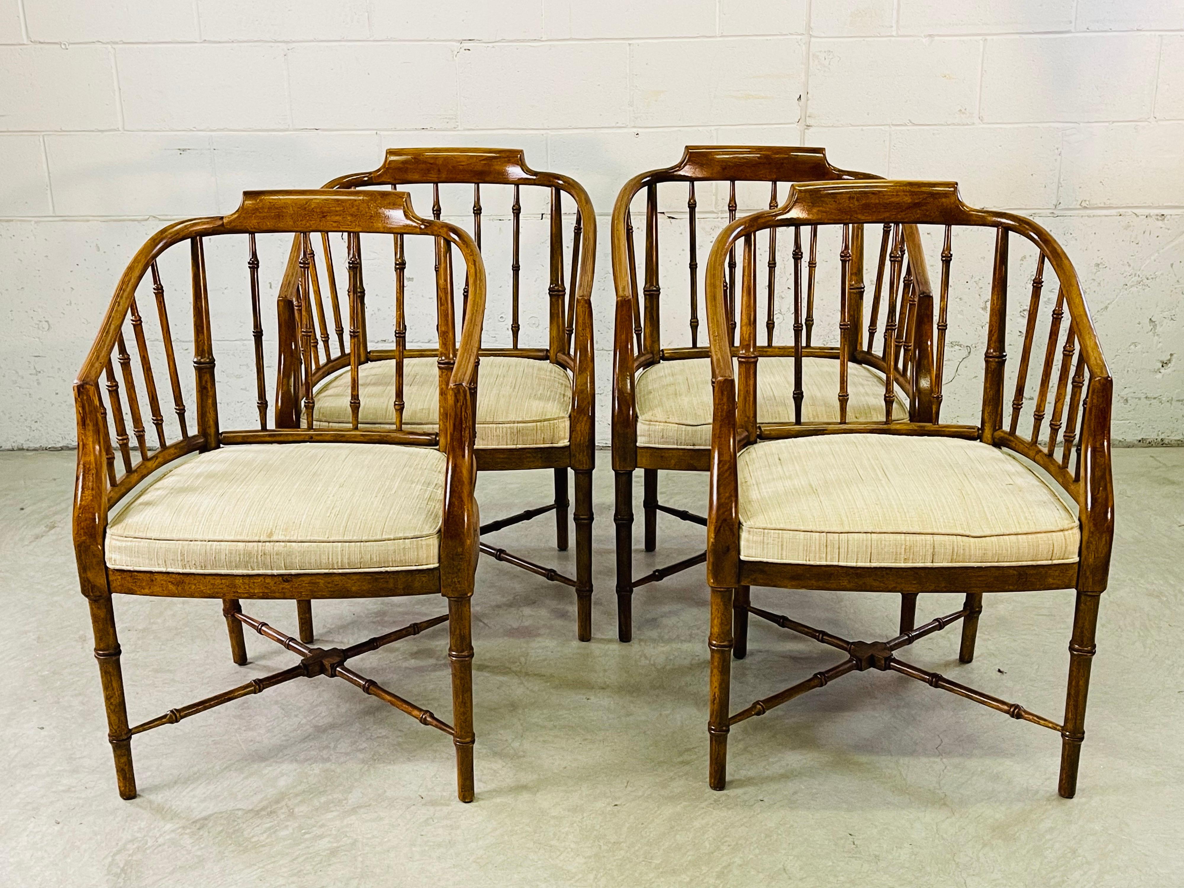 Vintage set of four Campaign style wood dining room arm chairs by Drexel Furniture. The chairs have a bamboo design. The arms on the chairs are slanted. Original fabric that needs replacement. All marked underneath. Seat, 18' H. Arm, 28