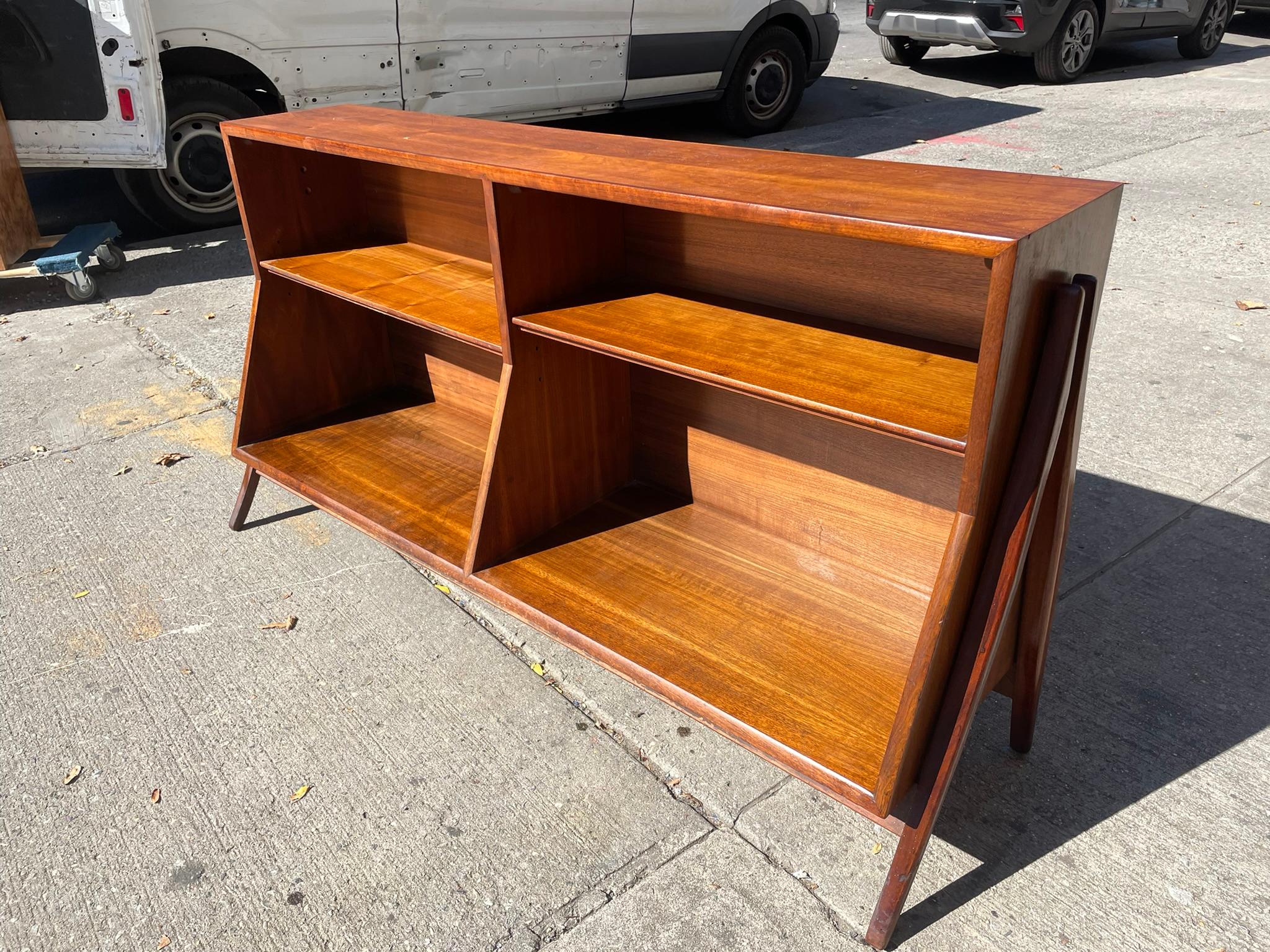 This fantastic credenza can be used as a TV stand, record cabinet, bookshelf or bar. Plenty of storage for records with adjustable wood shelves.
This unit has a Danish modern look with gorgeous flared legs and is constructed with solid wood legs