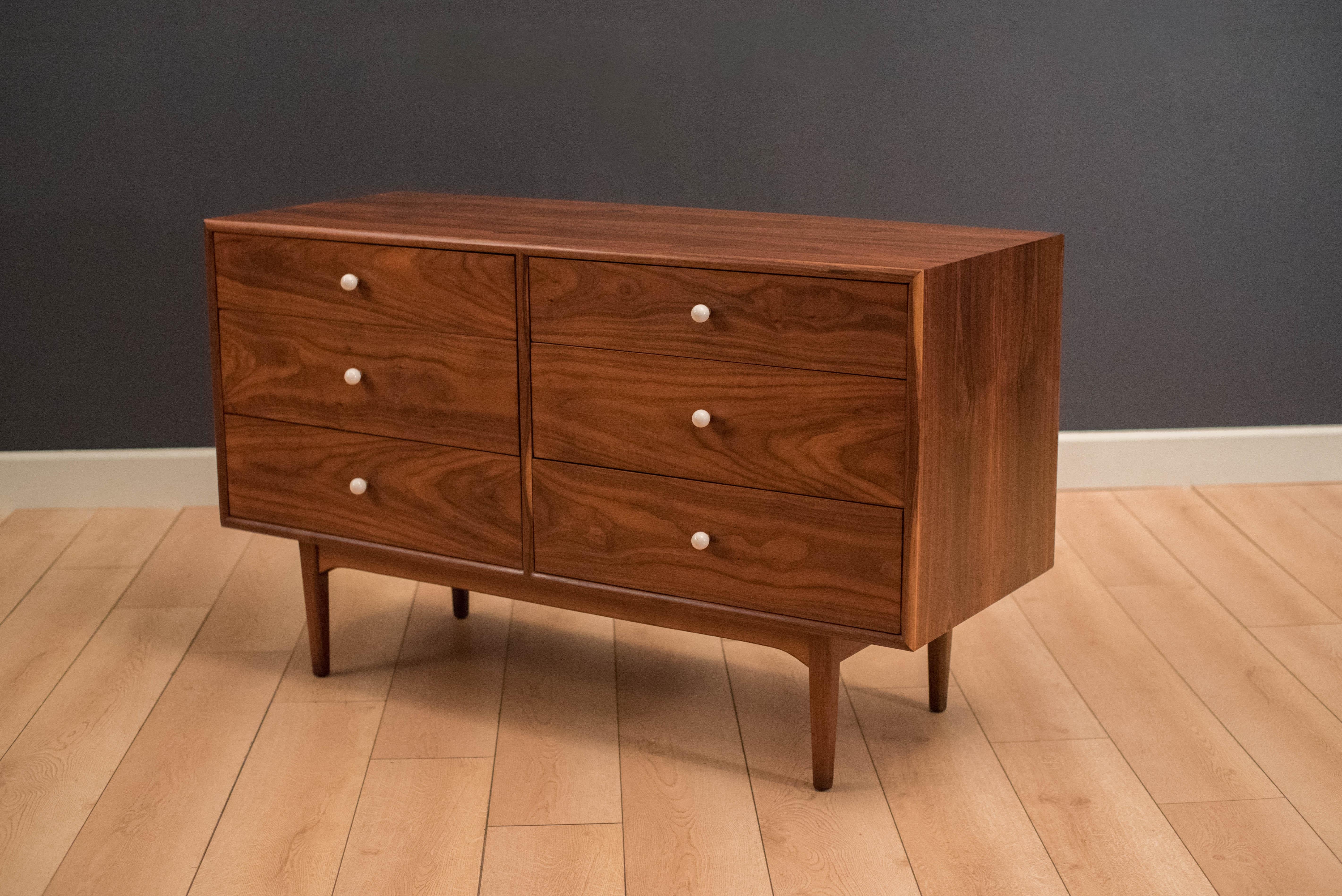 Mid Century Drexel Declaration low dresser by Kipp Stewart & Stewart MacDougall. This piece features book matched black walnut grains and includes their signature porcelain knobs. Includes plenty of storage with six dovetailed drawers.
 