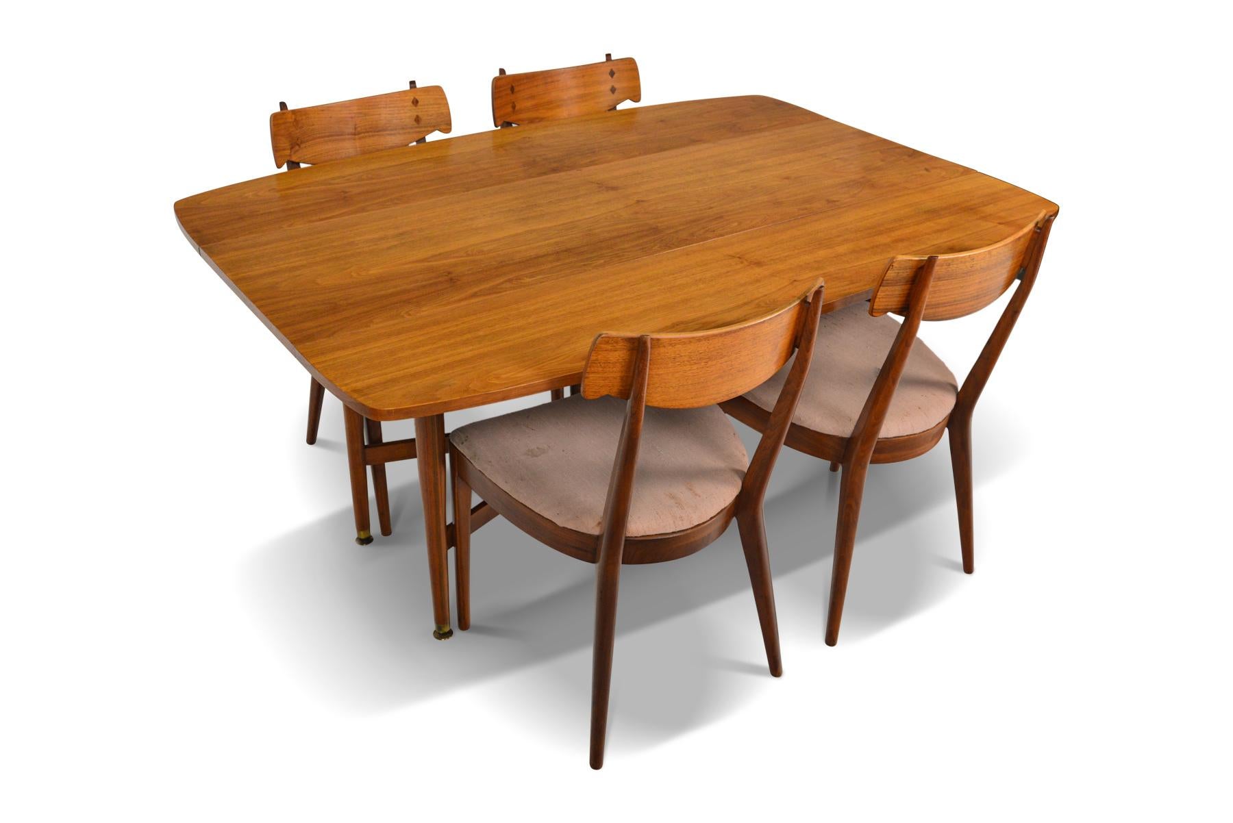 American Mid-Century Modern dining chairs and drop leaf tables from Drexel’s Declaration line. In excellent original condition. Price includes new upholstery.

Measurements (closed):
60? long x 17.5? wide x 28? tall
Expanded: 60? long x 42? wide