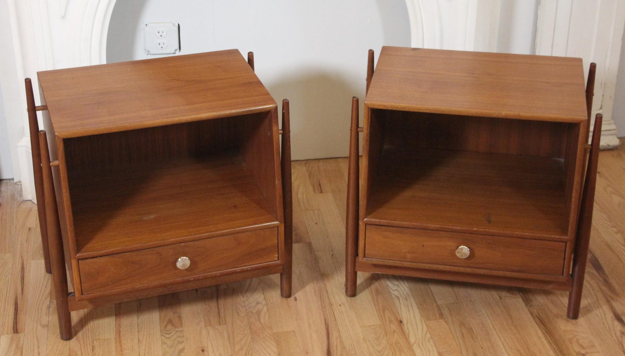 1960 pair of Mid-Century Modern night stands by Drexel. Part of the Declaration line designed by Kipp Stewart. Each stand has one drawer and a big cubby for storage.