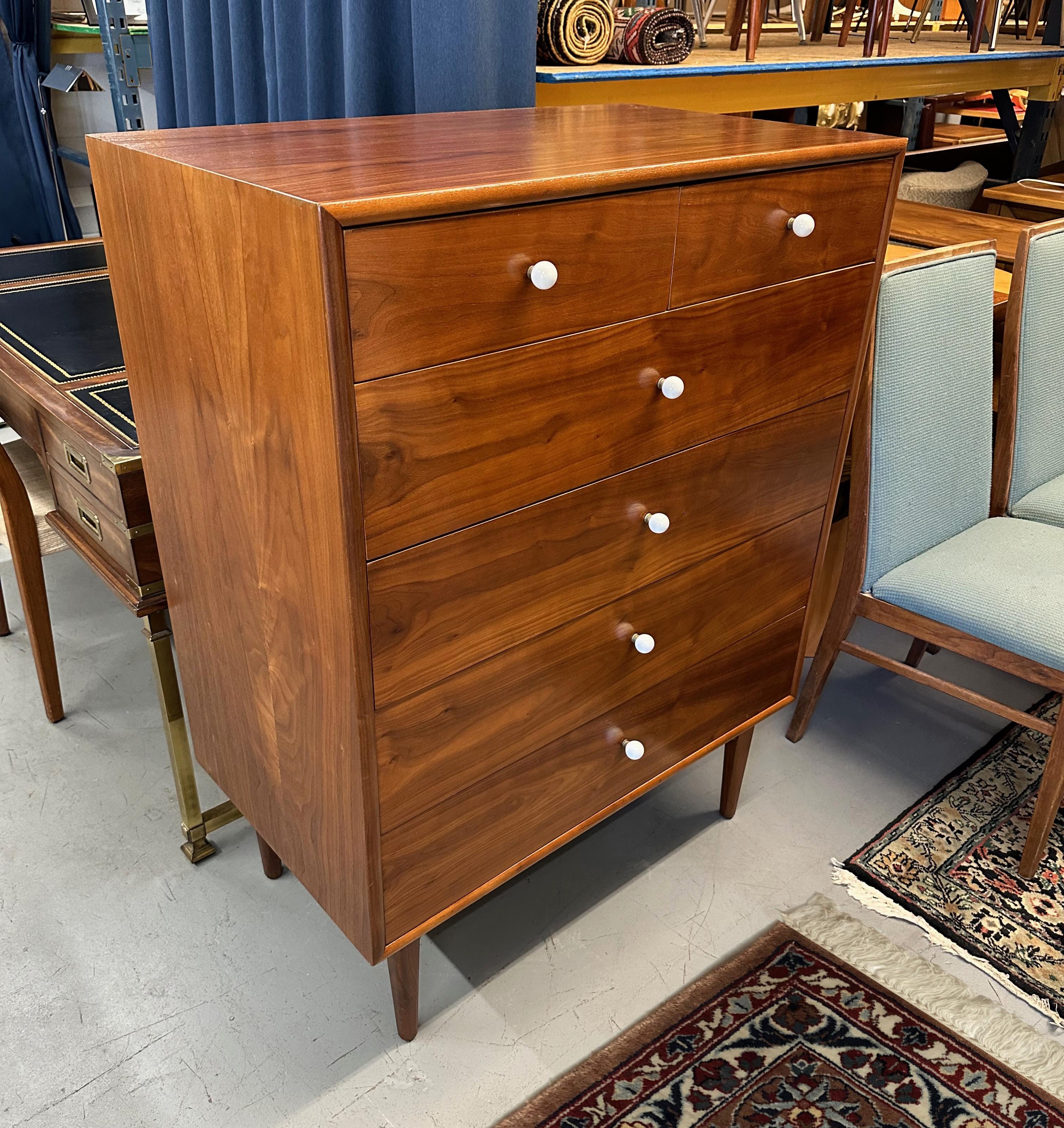 A late 1950s/early 1960s Drexel Declaration highboy dresser by Kipp Stewart and Stewart MacDougall in beautifully figured walnut. Newly professionally refinished.

Three drawers have removable dividers.

Markings on the back indicate this dresser
