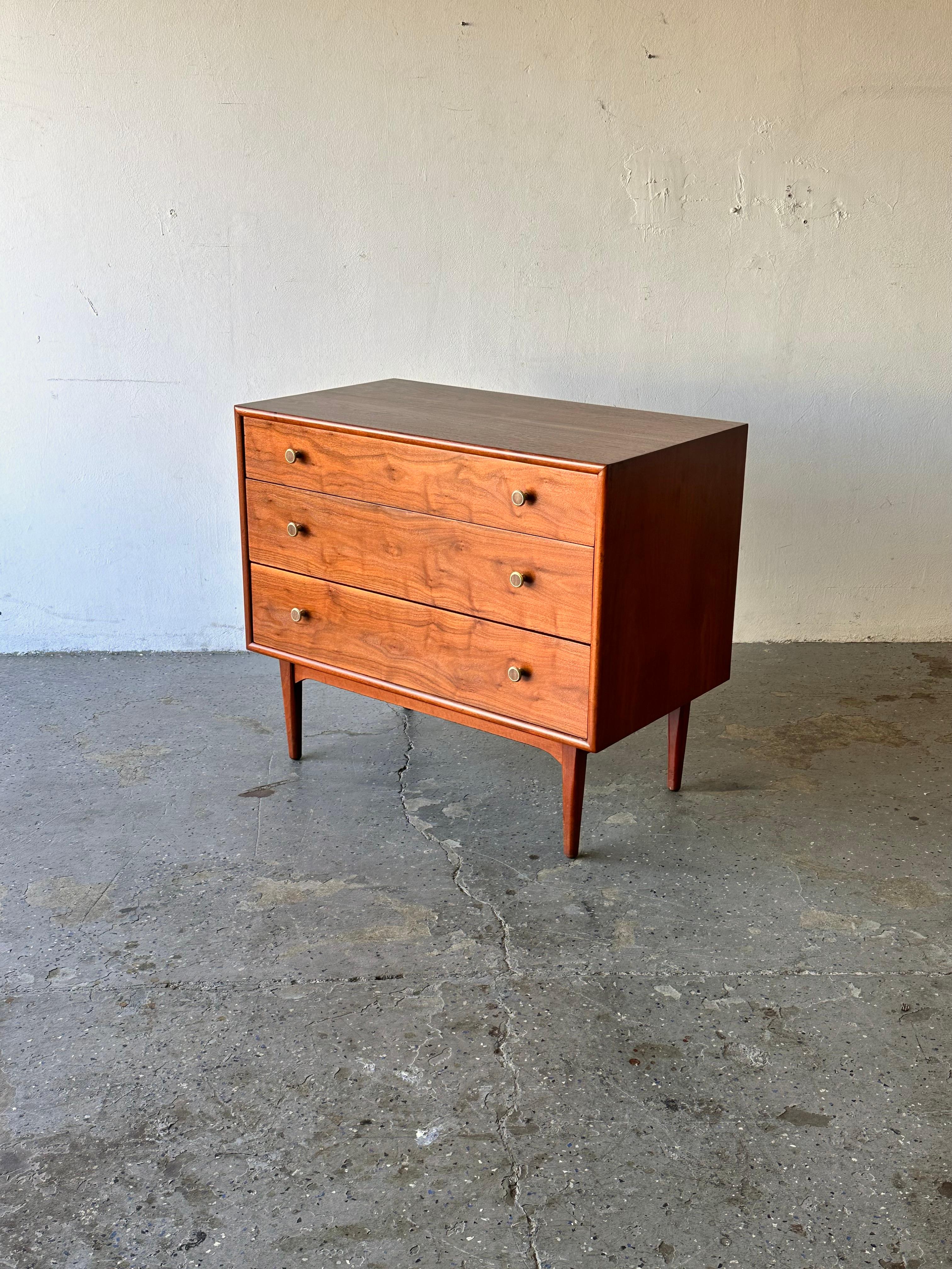 Fabulous Mid-Century Modern dresser bachelor chest designed by Kipp Stewart and Stewart MacDougall for Drexel’s Declaration Collection, circa 1960s. Featuring   beautifully grained walnut. Three dovetailed drawers, each is adorned with original